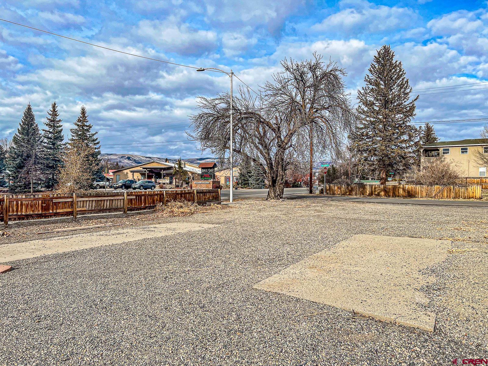 Are you looking for the perfect vacant lot in Cedaredge, Colorado? Look no further! This 0.16-acre corner lot is an excellent opportunity in a rapidly growing community. Whether you're looking to construct a home or a commercial building, this lot has it all. Electricity is already available on-site. And the best part? You can easily bring high-speed internet, natural gas, town sewer, and town water to the lot. Imagine the convenience and ease of starting your new venture with all the necessary utilities already in place. One of the biggest perks of this lot is its location along the Grand Mesa Scenic Byway. Known as the gateway to the Grand Mesa, this picturesque route offers breathtaking views and is a starting point for year-round mountain recreation. Whether you enjoy hiking, mountain biking, horseback riding, or ATV adventures, this region has it all. Additionally, being in the heart of Cedaredge means you'll be just a stone's throw away from the Pioneer Town Museum and many other local amenities. Cedaredge, Colorado, offers unparalleled opportunities for outdoor enthusiasts and small-town living. Located in Delta County, this region is known for its proximity to the Grand Mesa National Forest, where you can enjoy activities like big-game hunting, skiing and snowboarding at Powderhorn Resort, and fly fishing the Gold-Medal waters of the Gunnison River. On top of that, Cedaredge offers community events like free summer concerts and the annual Applefest celebration. With its amazing climate and access to world-class outdoor activities, Cedaredge is the perfect place to call home.