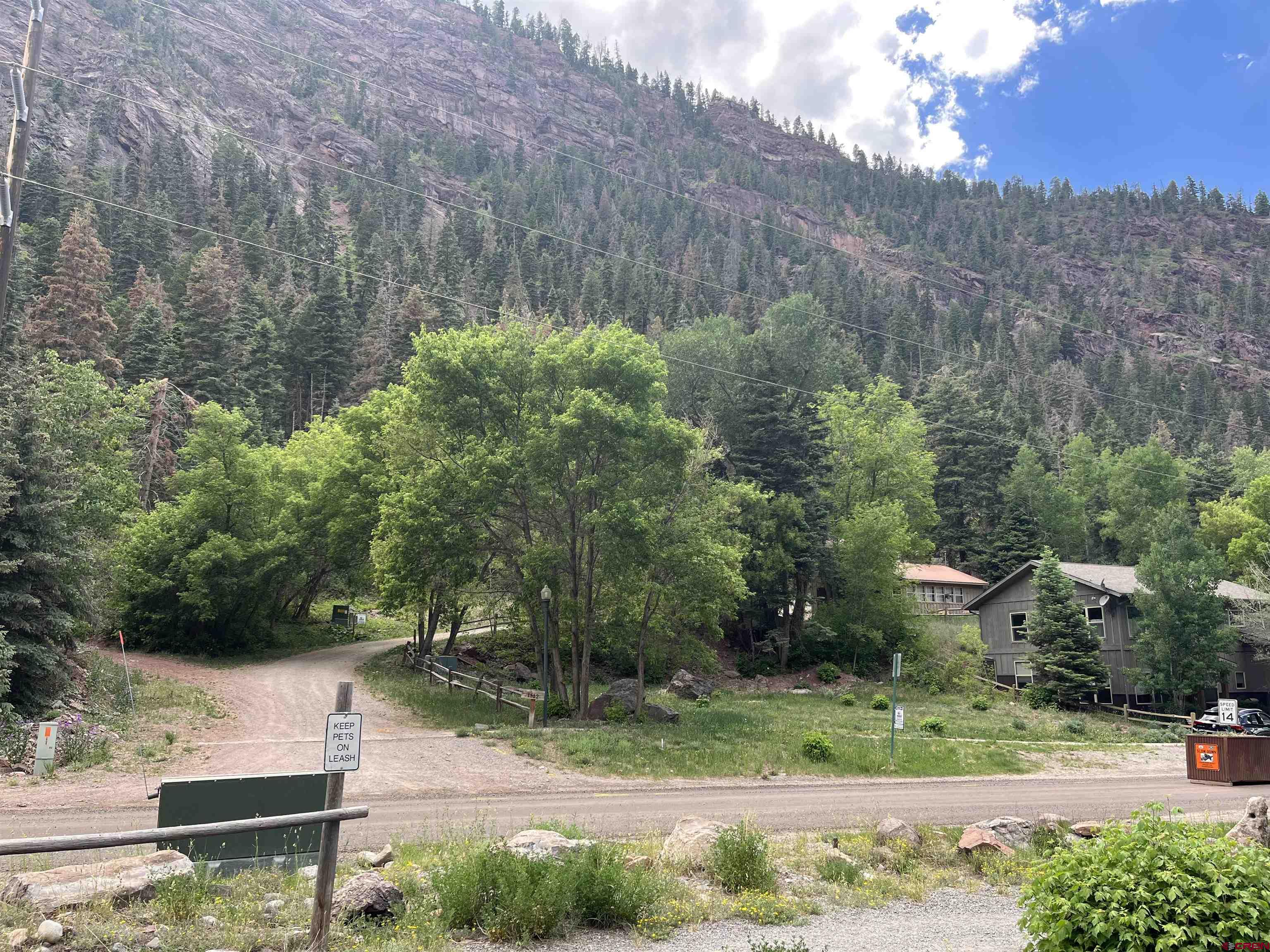 This multi- family zoned building lot is located just outside of the historic town of Ouray. Property is directly across from the Uncompahgre River, and  River Walk Trail, which is a 2-mile loop. This beautiful walking trail is used year-round by the locals. The 180-degree views from this property are over the top amazing. Unobstructed river views as well as Gold Hill directly right in your face. This property is close to town but just far enough away from the busyness of being right in town. All utilities are near the property line, including water, sewer, electric and fiber optics.  Build your dream single family vacation home, duplex or Triplex. Plenty of building options to fit your needs. If not familiar with Ouray, it’s a magical old western town. Once a hidden gem that is now being loved by many vacationers and tourists. Not many building parcels left in Ouray. Don’t hesitate and give this property a look. You won’t be disappointed in the location, views and neighborhood around it.