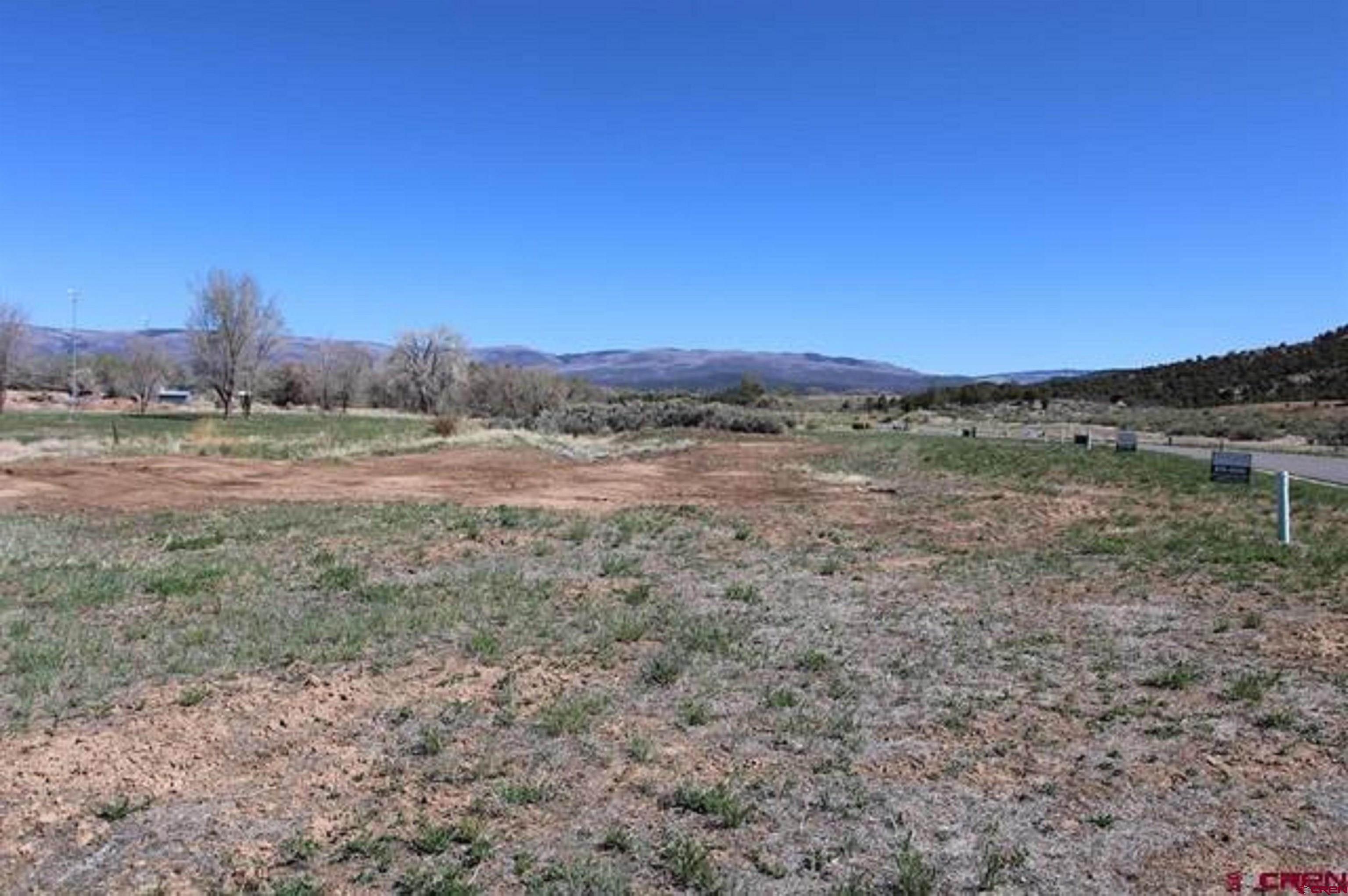 Great Golf Course lot located in Cedaredge Colorado  This lot is leveled with utilities very near and is ready to have your dream home built. Bring your builder, or we have one for you to meet! Within walking distance to the Cedaredge 18-Hole Golf Course and the walking trail along the constant flowing Surface Creek. Just a 30 minute drive to the top of Grand Mesa which is the largest flat top mesa in the world. Experience excellent snowshoeing, cross country skiing, down hill skiing, hiking, camping and fishing in over 300 lakes. Within one hour of the Powderhorn Ski Resort. Lot faces east with all utilities in place and ready to start building. Great Small town shops and restaurants to enjoy. Water and sewer taps are available to purchase through the Town of Cedaredge.