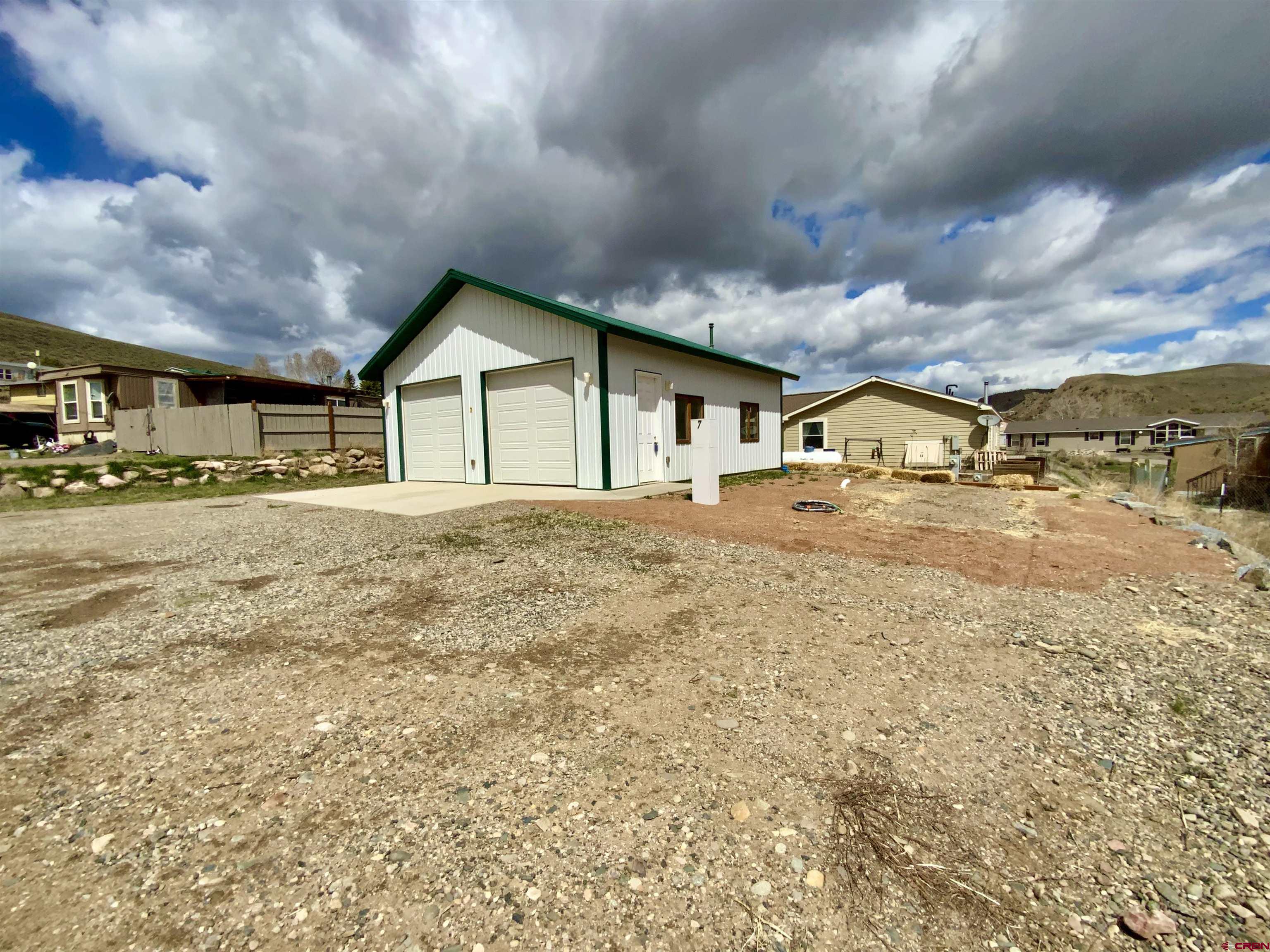 A very nice lot within Antelope Hills that is ready to move your mobile home too.  This lot has a 32x28 detached garage with concrete floor and electric. Sewer and Water Taps are installed. You could also park your 5th wheel camper for the summer adventures in the Gunnison Valley.
