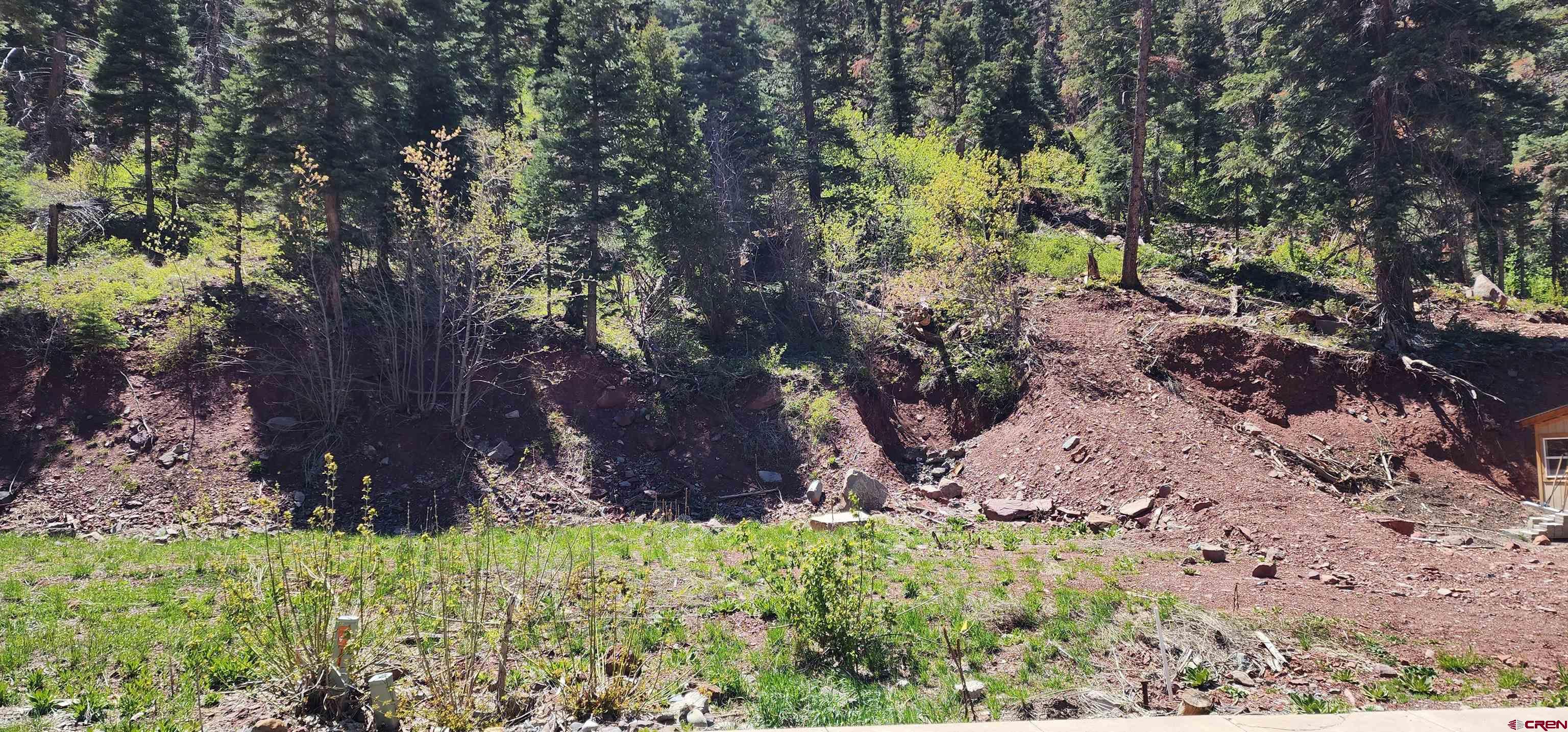 Ready to build lot in the resort City of Ouray. All utilities at the lot line. Property backs to National Forest with easy access to the Silver Shield trail. Unique views of old mining structures on the mountain side. Walk to town on the North Ouray Corridor trail loop along the Uncompahgre River. Zoning allows single family, multi-family, guest residence and other uses.