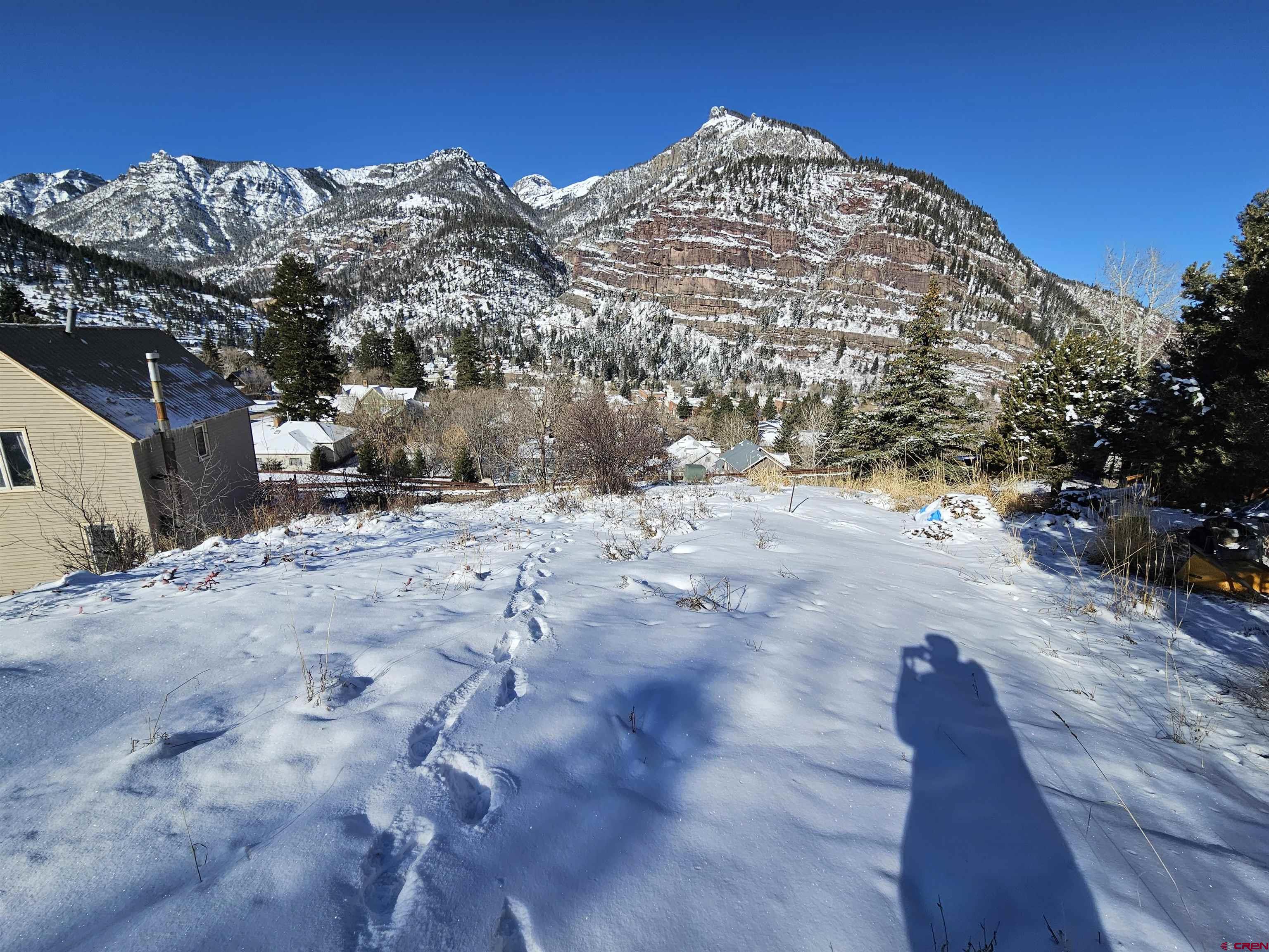 What a fantastic building lot on the upper east side of Ouray.  There is no chance of flood, avalanche or rockfall from this elevated location.  Dubbed the sunny side of Ouray, this lot is zoned R-1 which is a 30 day or more rental zone.  A true plus for this zone is your neighbors don't change every few days like the R-2 zone which allows short term rentals.  The elevation creates better views and less noise from the busy main street of Ouray.  This lot is 50' wide by 142' deep.  Electricity is 6 inches off the property line and water and sewer are in 6th Street.  This lot is on a dead end street so you don't have much traffic.  The house above it just sold for $2.4M.  This is a very attractive neighborhood.  All four corners are marked.  Come see this one and fall in love!