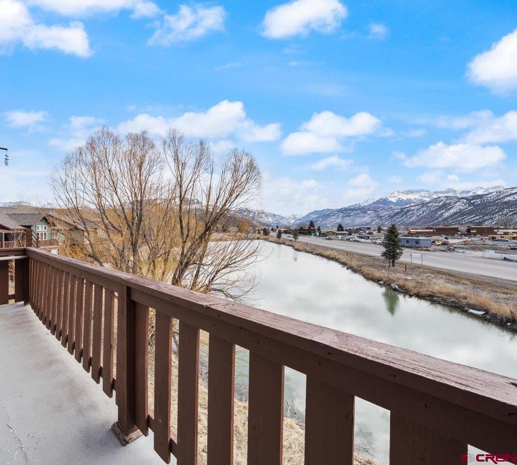 Cash Back Incentive to offset HOA dues for the year!  Enjoy the picturesque view from your kitchen or deck in beautiful Ridgway, Colorado. This well-maintained unit boasts very nice appliances including a brand-new microwave and granite countertops. The main living area has an open feel with excellent natural lighting letting in those stunning views. The carpet has been replaced throughout, and the hot water heater is new within the last few years. This place has all the things you want in your condo, too. Natural gas forced air heat, a stackable washer and dryer in an actual laundry room, and tiled entryway. Outside is an ideal carport spot with outdoor storage locker - to keep the snow off your vehicle and your outdoor gear protected. This unit hasn't been available since it was built. Schedule a showing today!
