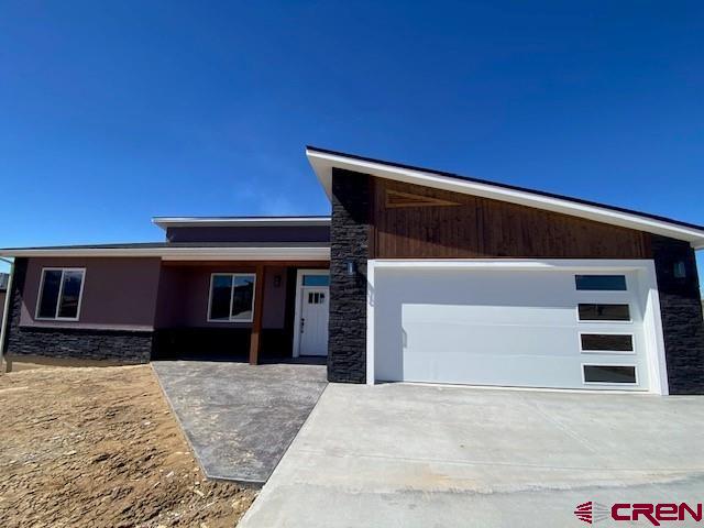 Brand New Construction of Exquisite Contemporary Style and Design in a very desirable location just south of the Cortez city limits. This planned unit development is located in Montezuma County but less than a mile to great  shopping, schools and restaurants with beautiful views of the mountains and vista's of the surrounding ranges. Blue Mesa Lot #2 is an 1,850 SF, 3 Bedroom 2 Bath Cruzan Creation of outstanding contemporary design and appeal with an artistic use of different textiles comprised of wood and stone accents, granite, ceramic tile, composite flooring and stucco exterior. Perfect maintenance free living for that family on the go or the couple that just wants to relax and enjoy the views while their at home. The Great Room effect has lots of natural light from the large windows that really shows off the granite and cabinetry in the kitchen and central island area. The Master Suite has a beautifully tiled bathroom and a spacious closet with views overlooking the deck and the western skyline. Sunset evenings will be an extra special event spent on the large covered deck that expands the entire length of the western side of the home overlooking the valley. This property is a fantastic opportunity own a very special home of Superior Appeal along with the ease and convenience of maintenance free living.