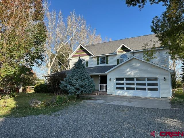 This beautiful 3-bedroom 2.5 bath home sits on 2.95 acres with ponds and irrigation water. The home has a wraparound porch, a shop area and also an additional office/storage space. Inside the home you will find high ceilings, hardwood floors, gas log fireplace, open kitchen with tile floors, a separate dining room and sitting room as well.  The main bedroom is large and has a walk-in closet and a jack and jill sink. The home is surrounded with mature trees which provide shade throughout the year, fruit trees, and a yard that gives you enough space to entertain and enjoy. This home sits on the end of a cul-de-sac and has a long private drive. This property is ready for you to enjoy and make your own!
