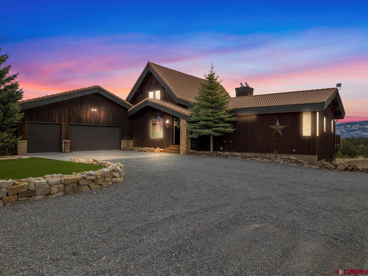 Welcome to your dream home in Ridgway, Colorado! This custom-built beauty boasts breathtaking views that simply cannot be replicated. With over $200k invested in new windows, every corner of this home is designed to showcase the stunning landscape of the San Juan and Cimarron Mountain Ranges.  Nestled on a spacious 9.6+ acre parcel, this property offers ample room for horses and endless opportunities for outdoor adventures. With snow on the ground, strap on your cross-country skiis right from your front door.  Discover the joy of observing wildlife footprints right from your own deck, as they wander through this extraordinary landscape. Imagine relaxing in the serenity of your private oasis while enjoying uninterrupted views of Nature's creation.  Inside, the main floor living area is thoughtfully designed for comfort and convenience. The gourmet kitchen, dining area, and living room feature an open-concept layout, accentuated by 20' windows that flood the space with natural light. Quartz countertops, tile floors, and high-end appliances including a Jenn-Aire gas range/oven add a touch of luxury to the heart of the home.  The main level also hosts a spacious en-suite master bedroom with a cozy fireplace and sliding glass doors leading to the deck. The master bathroom boasts quartz countertops, double sinks, open air double sided shower oasis, and a walk-in closet with a dressing area. Additionally, a guest room, full bath, and laundry room complete the main level.  Entertainment awaits in the 3-car attached garage, which includes a game room for endless fun. The lower level features three bedrooms, a bunk room, and a large family room with a wet bar and wine fridge. Whether hosting family gatherings or enjoying quiet evenings by the fire pit, this home offers ample space for all your needs.  With a total of 5 bedrooms and 4 baths, plus a versatile loft space that can be used as an office, library, or playroom, there's room for everyone to spread out and relax. Enjoy the benefits of pure, soft water in this home, complete with a full-home water softener system. Additionally, the kitchen boasts a brand-new reverse osmosis system, ensuring clean and purified drinking water for you and your family. Don't miss out on the chance to make this your forever home – schedule a showing today and experience the extraordinary lifestyle awaiting you in Ridgway, CO!