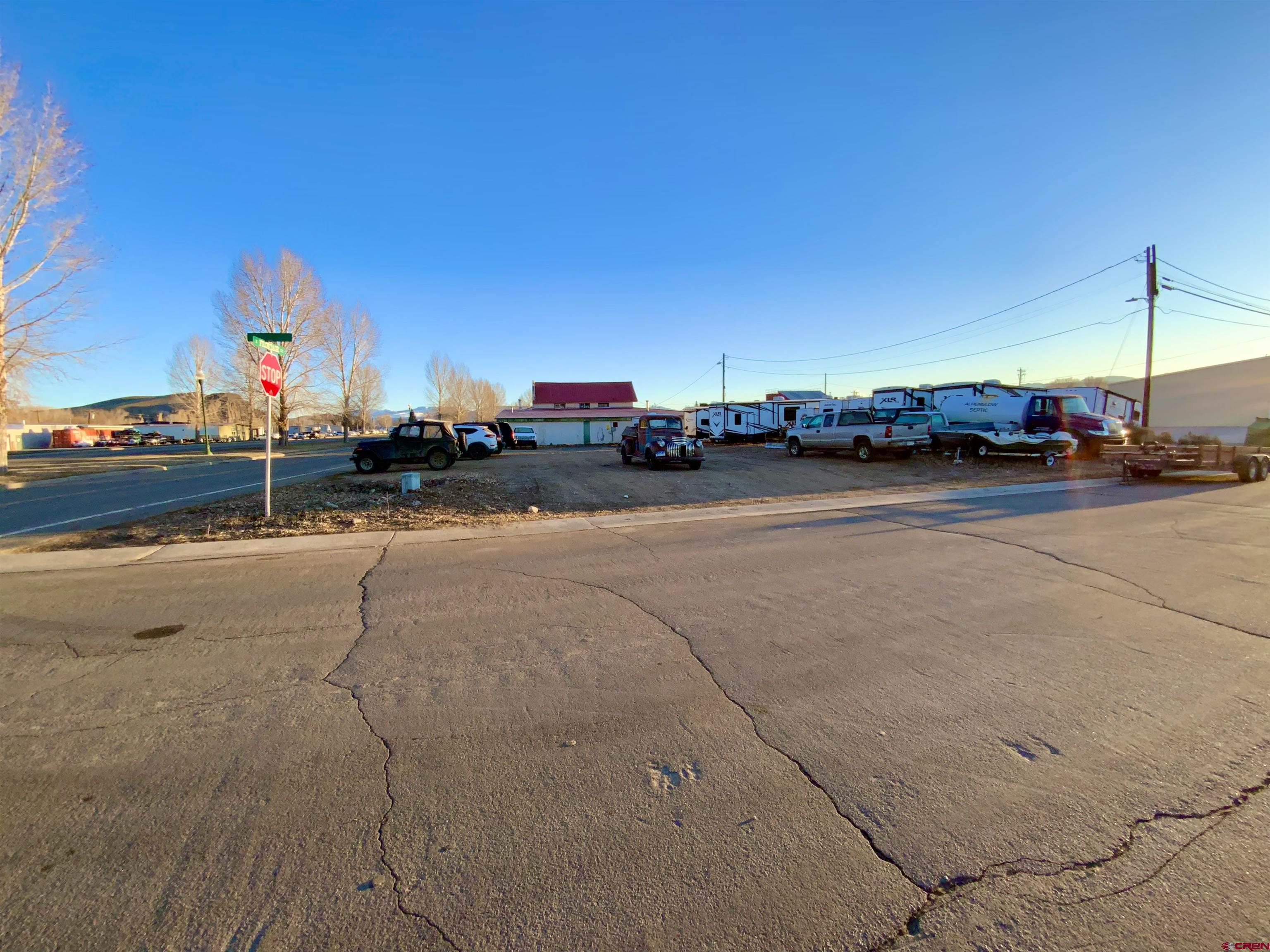 Great visibility, commercial corner lot located off the frontage road on West Highway 50.  This zone district is established to provide locations for offices, service uses, hotel accommodations, business retail and convenience goods.  Upper-floor residential dwellings are allowed.