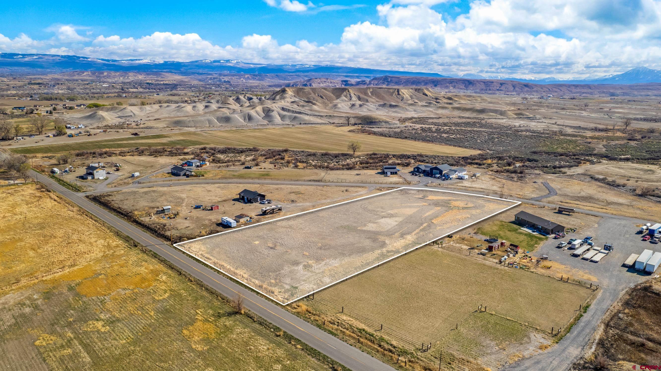 ARE you looking for an amazing Rural setting? This 3.49 acre irrigated lot with 1  share of Uncompahgre Water Users Association is waiting for you. Perfect for your new home build with plenty of room for animals, 4-H projects, toys and so much more! These lots are agricultural in nature and the taxes will be more affordable. Build your home, bring in a nice Modular or Erect that beautiful Barndominium and enjoy country living with close to town perks.  Minutes from downtown delta and only a half hour from Grand Junction or Montrose. The view from the wide open landscape are phenomenal.  Schedule your showing today before it's gone !!!