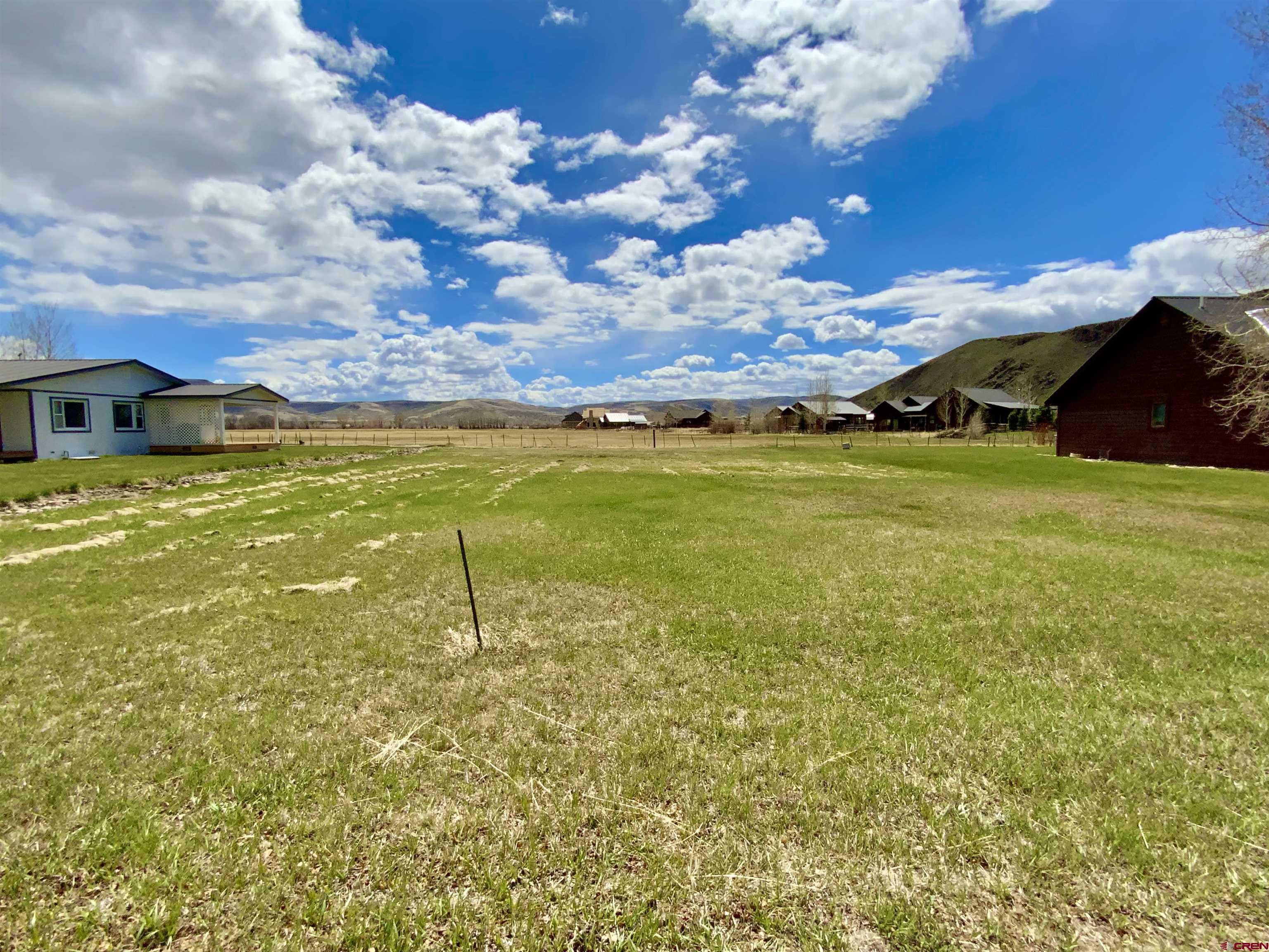 Looking for the perfect location to build the home of your dreams?  Check out 1080 Fairway Lane, a level building site located near the Dos Rios Golf Course.  Great views of the surrounding mountains and ranchlands to the back of the property.  The minimum square footage for the home is 1,400 and the garage minimum square footage is 400.