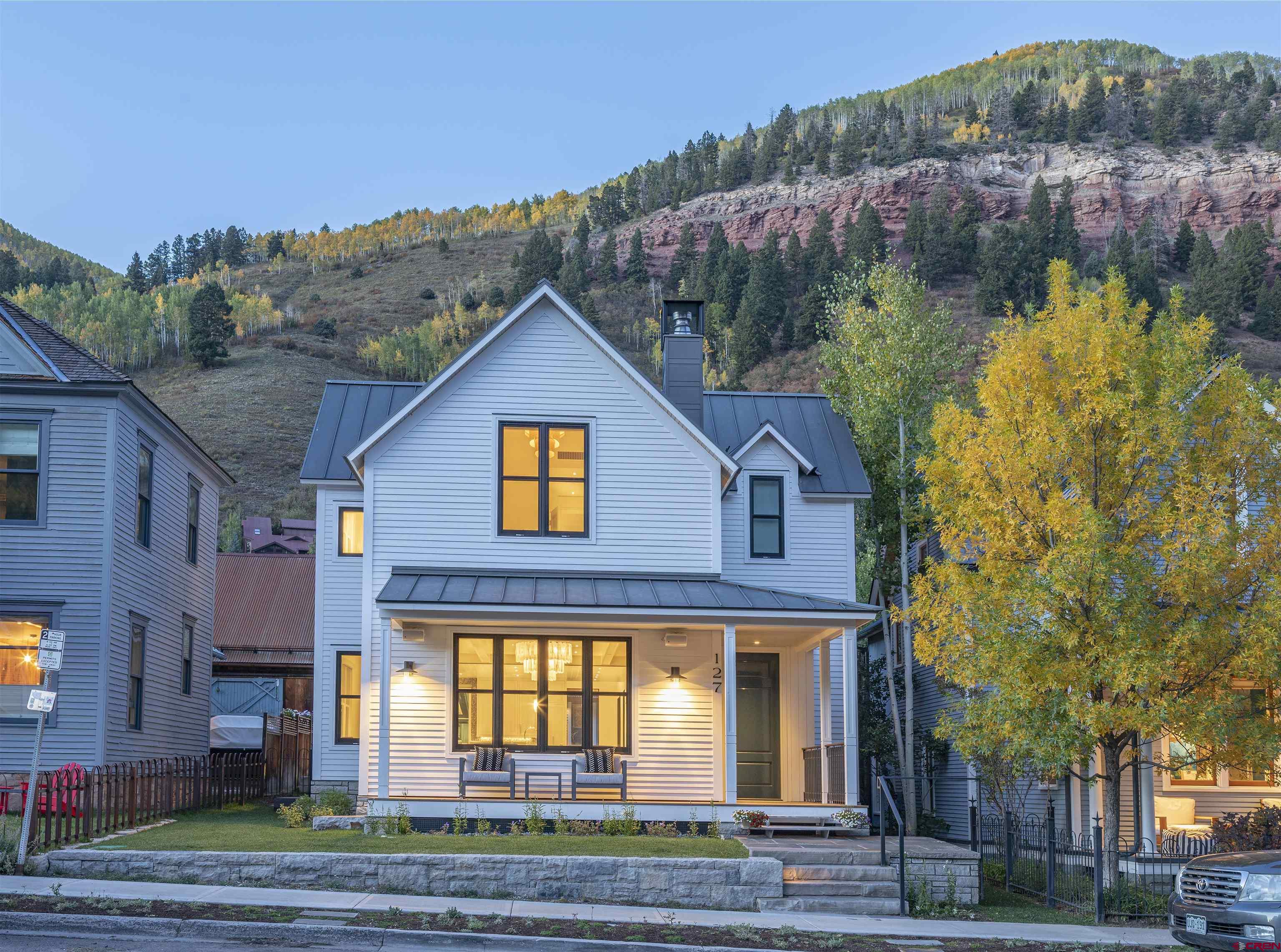 This exquisite high-end home designed by Sante Architects is located in the heart of the Town of Telluride, just one block from Main Street. This stunning property boasts 7 luxurious bedrooms and 7 beautifully appointed baths, providing ample space for family and guests.  The home features an open living and kitchen area, perfect for entertaining, with top-of-the-line finishes and furnishings that create an inviting and elegant atmosphere. The large yard offers plenty of space for outdoor activities and relaxation, while the garage and additional parking space provides convenience and security for your vehicles.  A unique highlight of this property is the remodeled 1915 guest house, seamlessly blending historical charm with modern amenities. Enjoy breathtaking views from various vantage points throughout the home, making every moment spent here truly special.  Offered fully furnished, this home is ready for you to move in and start enjoying Telluride in style immediately. Don’t miss the opportunity to own this exceptional property in one of the most sought-after locations in town.