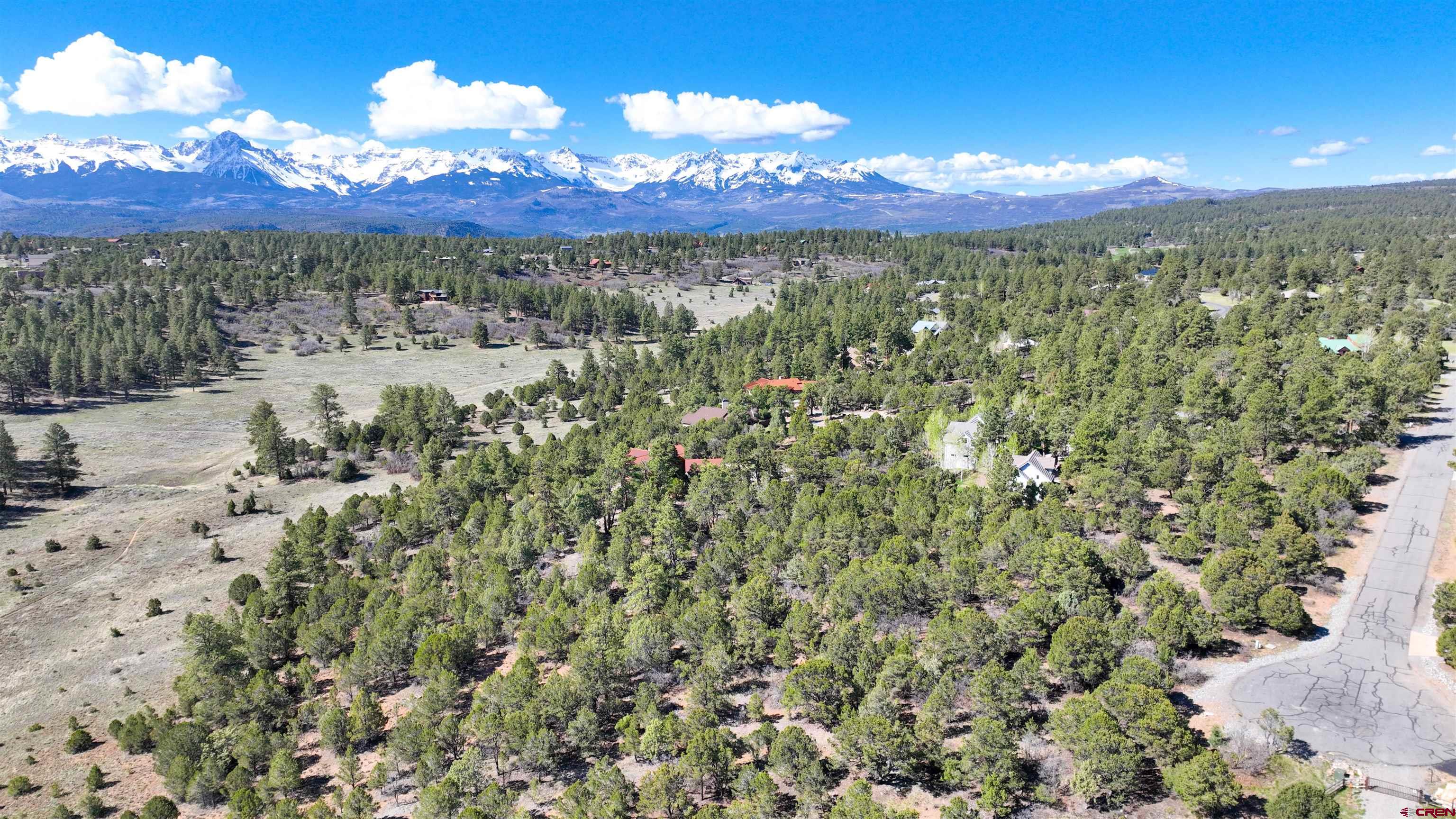 This nearly 1-acre lot in Divide Ranch and Club offers an exceptional opportunity to embrace the views of  San Juan and Cimarron mountain ranges with its elevated location. Situated on a cul-de-sac, expiorence privacy. Its convenient location places it just 15 minutes from Ridgway, providing easy access to amenities, while Montrose is only 30 minutes away, and the renowned ski destination of Telluride is a scenic 45-minute drive. However you look at it this lot offers you the opportyunity to build on a exceptional homesite.