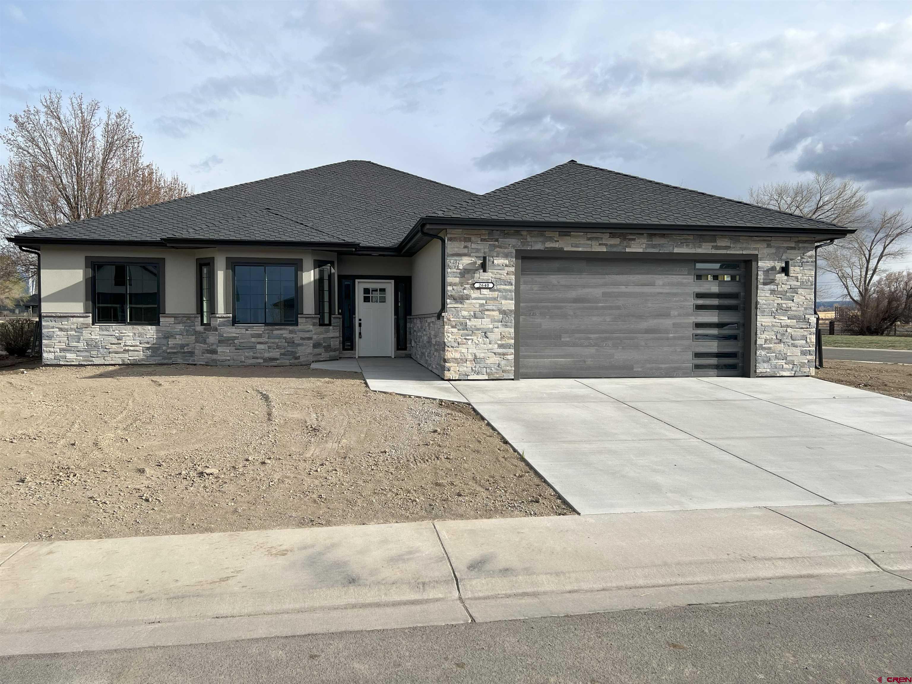 New home, construction completed!  San Juan and Cimarron Mountain views off covered shady back patio. Open great room floor plan with split bedroom layout. Large bedrooms with oversized closets. Master bedroom has 2 large walk-in closets. Large prep and bar counter in the kitchen with spacious pantry and gas range/oven. Refrigerator and dishwasher included. Roomy dining area 13 x 8 1/2. Floor joists have been recessed into the crawl space to allow for no steps into or out of the home. Nine-foot ceilings throughout. The exterior is stucco and stacked rock.