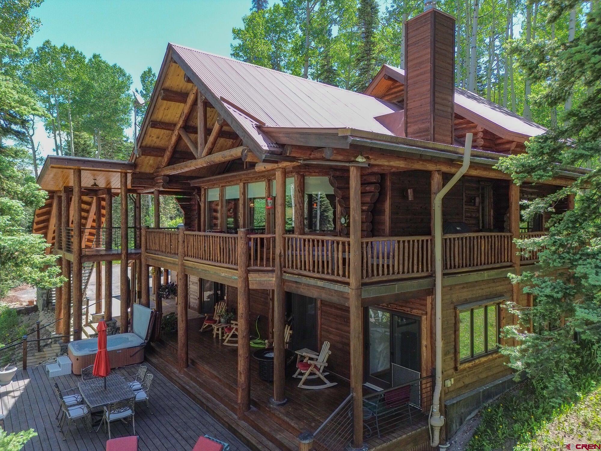 This serene mountain retreat is nestled in the coveted Ski Ranches neighborhood of Telluride, Colorado. This stunning property at 47 High Noon Lane offers a mountain lodge aesthetic with 5 bedrooms. Multiple decks and patios allow for enjoying alpine sunsets and starlit skies, with ample space for outdoor dining and relaxation. The home includes a cozy fireplace, a private hot tub, and convenient access to hiking trails and ski slopes. Whether you seek a tranquil retreat, a base for outdoor adventures, or a place to entertain in style, this property offers the ideal blend of luxury and natural beauty. Discover the magic of Telluride living at its finest.