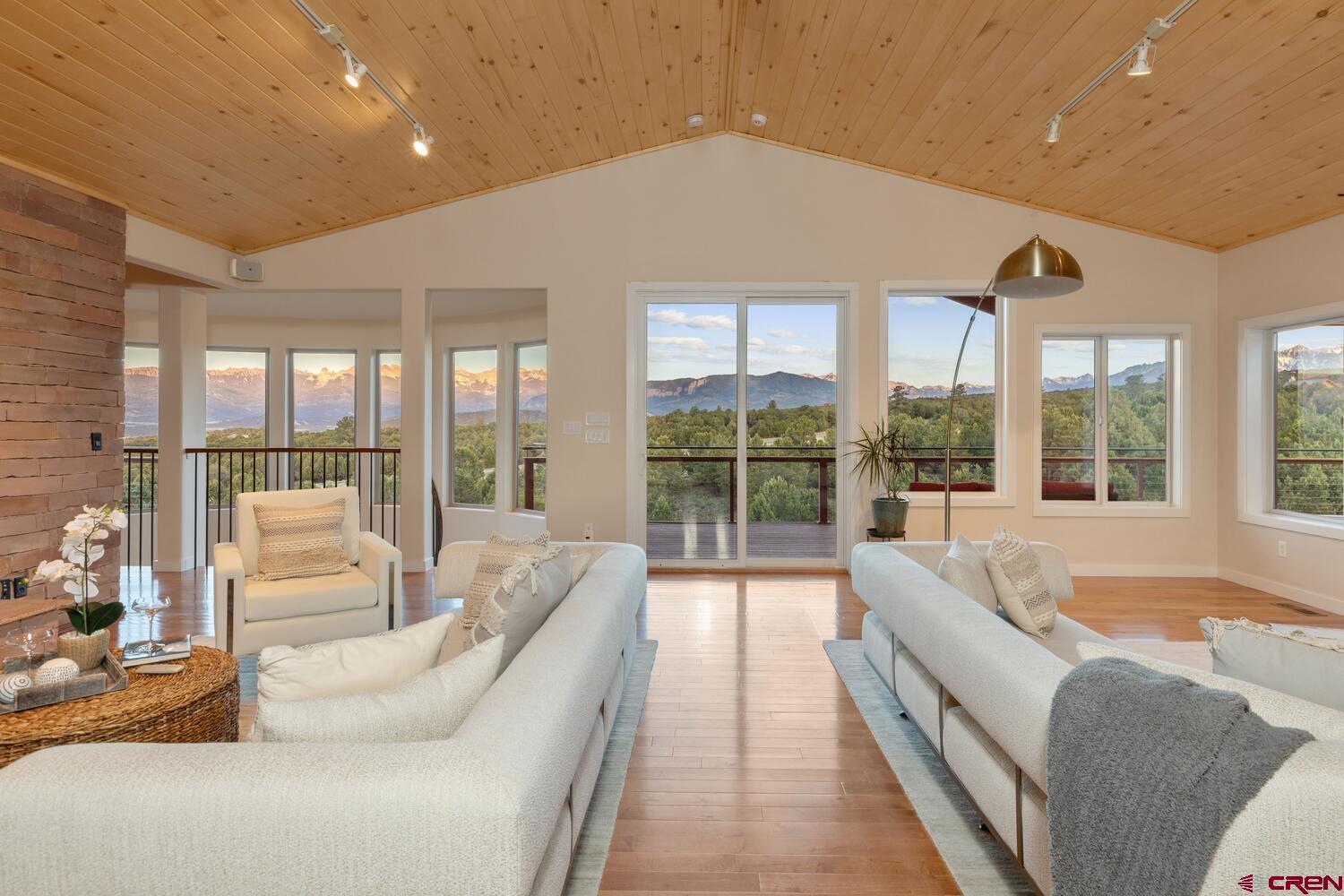 Escape to your own private paradise on over 18 acres of pristine land boasting breathtaking views and unparalleled natural beauty. This expansive property features a spacious main residence with 5 bedrooms, offering ample space for comfortable living for extended family and entertainment. With 4.5 baths and 4930 square feet of livable space, as well as 1693 Square Feet of attached Garage Space, this home provides both luxury and functionality. Step outside your living room of windows, onto the expansive 1565 square feet of deck space, including nearly 1200 feet of retractable covered deck facing south and east, providing the perfect vantage point to admire the stunning vistas of the Cimmaron and Sneffels Mountain Ranges any time of year.  Located atop Log Hill Village in the picturesque town of Ridgway, this property offers convenient access to the area's top amenities. Enjoy world-class skiing at Telluride, just a scenic 45-minute drive away, or indulge in boating and water activities at the nearby Ridgway Reservoir. For golf enthusiasts, the Divide Ranch and Golf Club is just 5 minutes away. The historic town of Ouray, known to be the little Switzerland of America, with world-class ice climbing in winter and off roading in summer is just minutes away.   This property also allows for horses and livestock, a rare find in this area of Loghill Mesa, making it ideal for equestrian enthusiasts as well. The home has been thoughtfully set up with a multitude of systems to make life easier and more enjoyable. From air conditioning, humidification, on demand hot water, expansive Solar System with battery backup, whole house audio System in both the interior and exterior, and heated 3-car garage plus a large fourth bay set up to store a large RV.  Additionally, the owner has thoughtfully included a detached Solar Heated Garage boasting over 2100 Square feet. Currently utilized as a workspace, equipment and car storage, this extra space offers endless possibilities for Boat or Car Enthusiasts. The Detached Garage features a Full Bath and has an additional loft space that could serve as entertainment space for gathering to watch sporting events.   Don't miss this rare opportunity to own a piece of paradise in the coveted Ridgway area, where nature, adventure and luxury seamlessly converge.