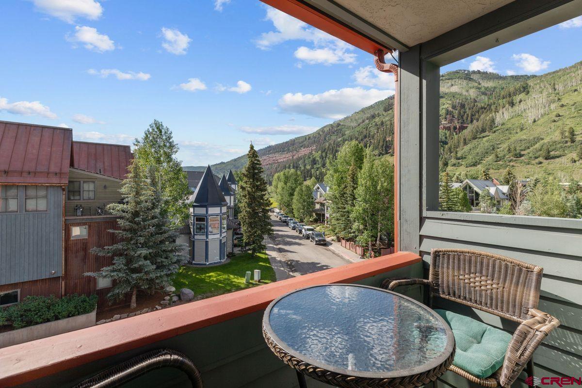 Welcome to this exclusive opportunity at Telluride Lodge! Offered for the first time since the complex was built, this meticulously maintained two-bedroom, two-bath condo boasts stunning views of the ski area, Ballard Peak, and sunset filled skies to the West.  Situated on the upper floor, this unit features a covered balcony—a rare amenity for upper units at the Telluride Lodge. Owned by a single owner since the complex was built, this condo is now available fully furnished and turnkey, offering immediate rental potential or a canvas for your personalized remodel. Perfectly positioned across from the River Trail, Chair 7, and the Galloping Goose’s free in-town transportation, Telluride Lodge provides unparalleled convenience. Enjoy dining, grocery store and shopping, all within a block of your doorstep. Amenities abound with both outdoor and indoor hot tubs, complemented by a coveted 2.5-acre green space ideal for grilling and gathering with friends and family. Don’t miss this rare chance to own a slice of Telluride paradise.