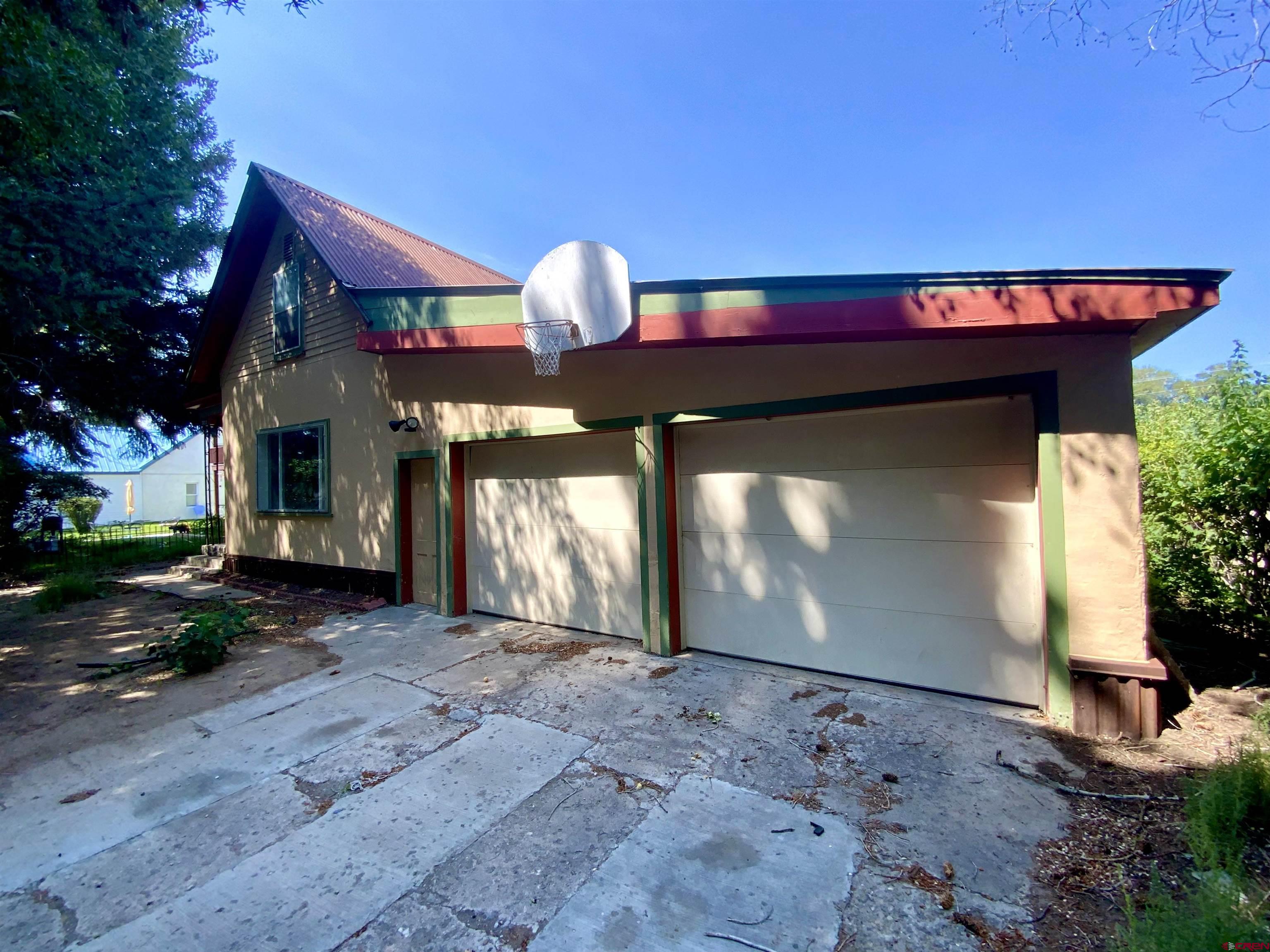 311 N 12th Street is a 3 Bedroom/1 Bathroom home within the city limits of Gunnison. Kitchen has stainless appliances and a pass through to the dining area. Wood floors and new paint throughout the property. The full bathroom is located on the first floor. 2 bedrooms are on the main level with a large upstairs bedroom. Property also features  a large 2 car garage and includes a separate RENTAL HOUSE which is a 1 bed/1 bath that rents for $700 per month, which will help with the monthly payment. This property is move in ready.  Schedule your showing today.