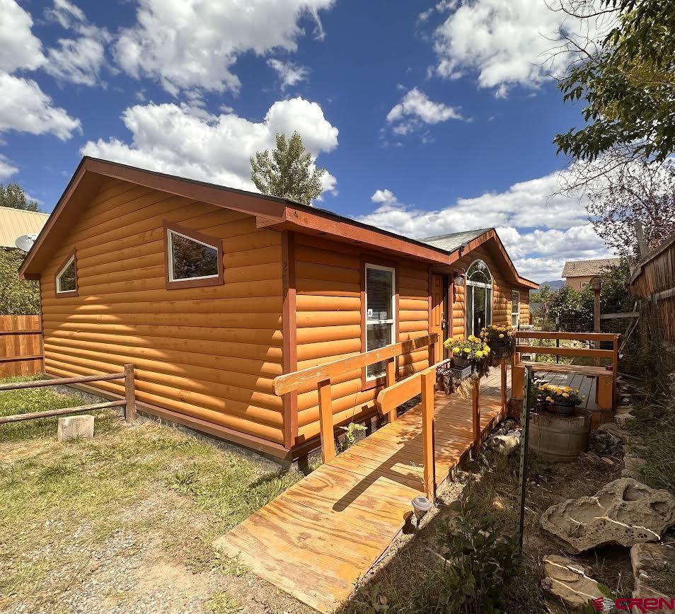 This 3 bedroom/2 bathroom remodeled home is located right in the middle of  Ridgway within walking distance of downtown.  Large kitchen/eat in dining with a beautiful light fixture, nice double sink, refrigerator, range/oven and includes washer/dryer.  Bathrooms have been remodeled with new fixtures.  Nice lot with storage units.  This home will be sold as is and will be transferred  by a personal representative deed.