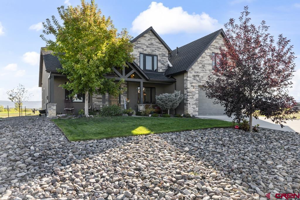 Discover Your Dream Home in Montrose: A Contemporary 2-Story Oasis in The Bridges!!   Looking for the perfect blend of comfort and style? This stunning 2-story home in Montrose is designed to meet the needs of modern families and individuals. Boasting 4 bedrooms and 3 bathrooms, this contemporary residence features an inviting main level master suite while offering three additional oversized rooms upstairs—perfect for growing families or guests. With 2419 square feet of thoughtfully designed living space, this home is ideal for those seeking both luxury and functionality. The main floor layout promotes convenience, enhanced by an elegant separate dining room and a beautiful staircase that impressively connects the two levels. Enjoy the seamless transition between indoor and outdoor spaces with large windows that flood the interior with natural light, enhancing the warm ambiance throughout.  Modern Comforts and High-End Finishes Step into a world of modern comforts with stainless steel appliances adorning the spacious kitchen, making it a dream for both seasoned cooks and casual entertainers. The flooring throughout this home is a harmonious blend of hardwood floors and tile, ensuring durability without sacrificing style. The bathrooms feature exquisite tile accents that elevate the overall aesthetic. Adding to the appeal of this property, the home is built using high-quality stucco and rock siding, showcasing a contemporary exterior that requires minimal maintenance. With a slab foundation and a durable composition roof, this house will keep you cozy and worry-free for years to come. Outside, the low-maintenance yard features mature trees, offering shade and charm and enhancing the overall tranquility of the lot.  Set on a 0.23-acre lot, this lovely Montrose home is not just a house; it's a gateway to the stunning recreational opportunities available in Western Colorado. Nestled near the majestic Colorado mountains, outdoor enthusiasts will enjoy a wide array of activities including fishing, four-wheeling, hiking, and skiing. Explore nearby attractions like the breathtaking Black Canyon, the ski slopes of Telluride, and the picturesque landscapes of Ouray. Nature lovers can take advantage of the nearby Grand Mesa National Forest, ensuring weekends are packed with adventure. Don’t miss this rare opportunity to own a golf-course home in such a beautiful area.