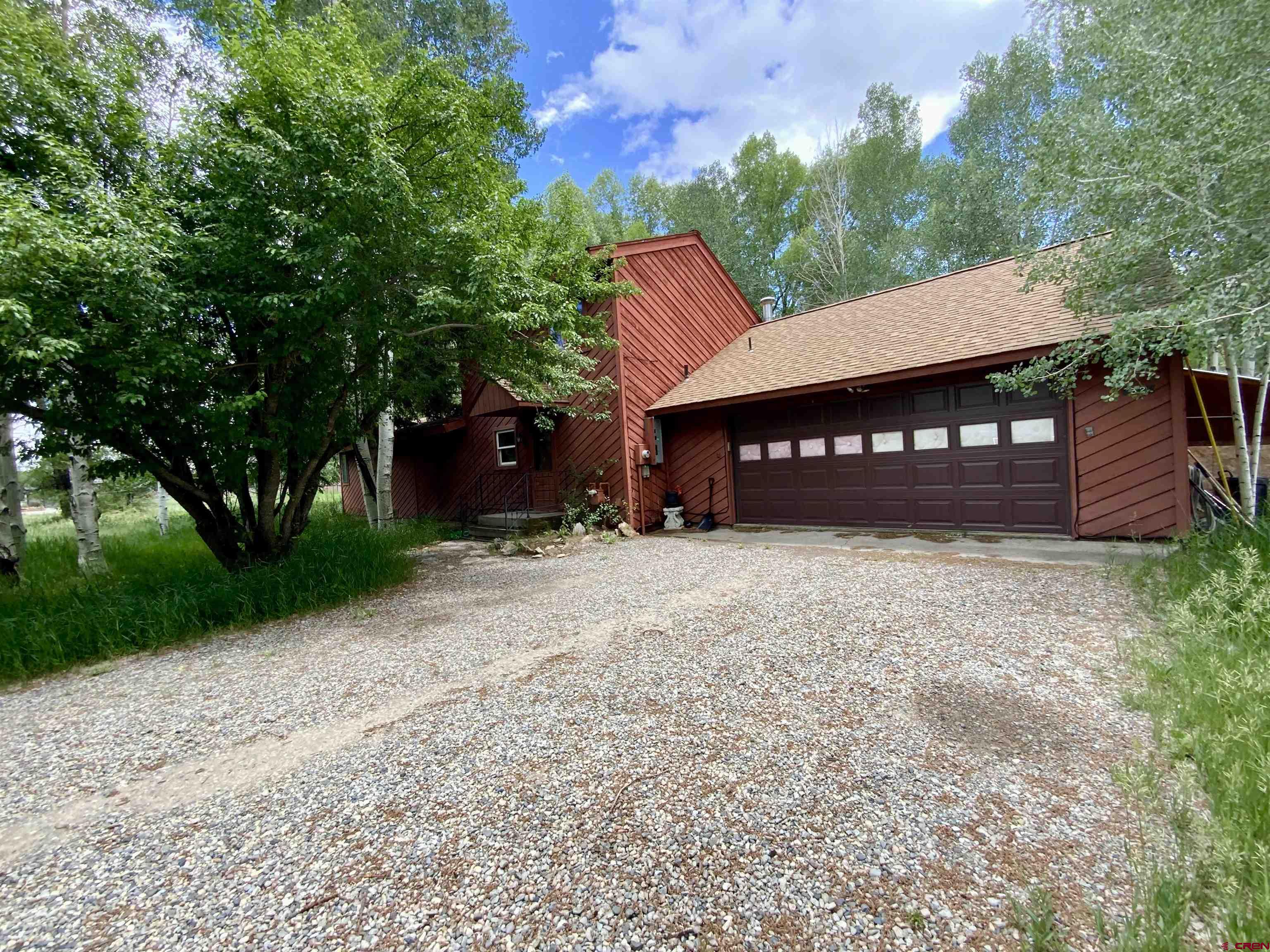 Charming 1,300 square foot riverside home nestled along the scenic Gunnison River offers the perfect combination of comfort, convenience, and outdoor adventure. Located just 15 minutes from Blue Mesa Reservoir, 30 minutes from both Crested Butte and Taylor Reservoir, this 3 bedroom/2 bath home is a nature lover’s dream.  The kitchen and living room provide a welcoming space for family gatherings, with plenty of natural light and river views.  The first floor master bedroom offers ease of access, with an additional main level bedroom and a loft bedroom upstairs provide ample space for family or guests.  The home also boasts a spacious two car garage, perfect for storage and vehicle protection.  Whether you’re seeking a peaceful riverside retreat or an adventure filled mountain base, this home’s ideal location gives you quick access to world class fishing, hiking, skiing, and more—all within a short drive.