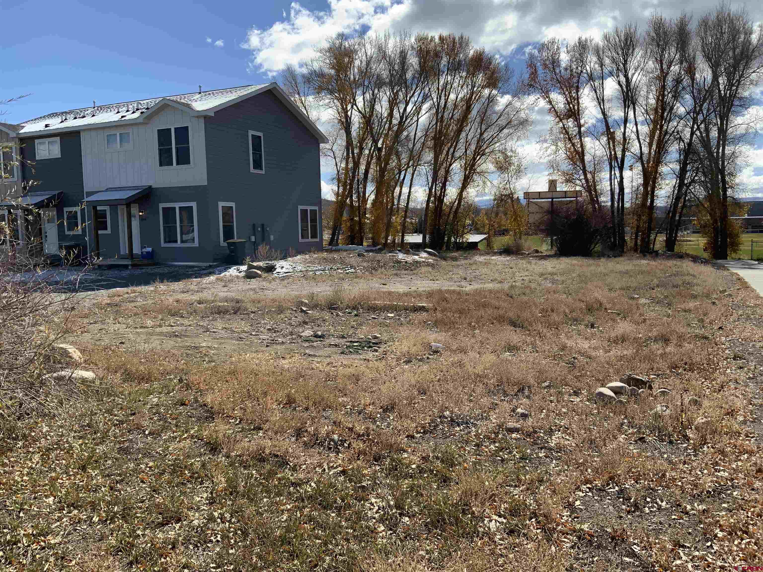 Development opportunity!  Here’s your chance to purchase R-3 lots and finish the West End Townhomes for a spec option, rental investment or employee housing.  Endless opportunities for completing this project that has City approved site plans allowing for two more duplex units.  The water and sewers taps are already in for the remaining units, but the taps need paid.  Design plans are for just over 1,300 square feet with open floor plan, 9-foot ceilings and large windows for plenty of natural light.  Unit is two stories and 3 bedroom/2.5 bath with an individual storage shed.  Centrally located near the schools, RTA bus stop and borders the Van Tuyl trail system.  Long term and short-term rentals are allowed.  Calling all builders or developers to create 4 more Townhomes for the Gunnison Valley.
