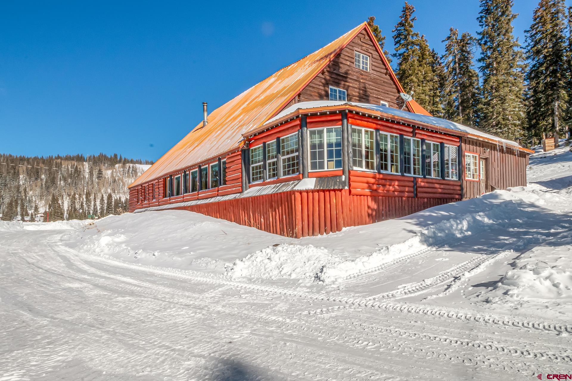 Tremendous opportunity to own an iconic lodge on the Worlds largest flat top mountain! This historic landmark is open year round with ideal access making it a destination for Summer and Winter activities alike! Situated on 10+ private acres in the middle of the Grand Mesa National Forest making this a very unique and special location. This turn-key business is ready to take over with tons of room for improvements/expansion. The owners have done the hard part by setting up the domestic water, septic, and power for several additional cabin and/or RV sites. The lodge offers a kitchen/restaurant and bar with separate dining areas and 2 bathrooms. The upper stories serve as the owners residence with 6 bedrooms and 3 bathrooms. On the property are 7 different cabins and a 8 room motel with different themed rooms. All are turn-key, up to date, and fully furnished. The lodge stays busy with repeat clients, wedding bookings, and local summer and winter enthusiasts that utilize the restaurant and bar. Recreation opportunities are really unlimited on the Grand Mesa and the endless winter and summer trails make destinations from the lodge a real possibility. So many options to make this operation yours with real growth potential. Over 270 reservoirs and lakes, endless winter and summer trails for nordic skiing, snowmobiling, atv's, horseback, ect. Also tremendous fishing opportunities, and excellent big and small game hunting too. Call today for more information or to set up a private tour.