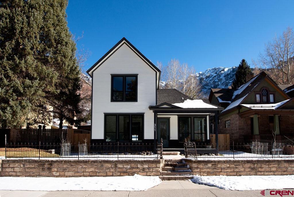 Step into a rare opportunity to own a piece of Ouray history with this beautifully remodeled Victorian home, located right on Main Street in the Switzerland of America. This iconic property, recognized on the Ouray County Historic Register, seamlessly blends old-world charm with modern mountain luxury. The home’s stunning exterior pays homage to its Victorian roots, while the completely renovated interior offers an elegant yet cozy retreat with all the conveniences of contemporary living. Enjoy high-end finishes, spacious bedrooms, and breathtaking views of the surrounding mountains. Restaurants, shops, hiking trails, the famous Ouray Hot Springs, and the world-renowned Ouray Ice Park are steps away. Zoned as C-1, this property is available for residential or commercial use, providing incredible flexibility for a variety of opportunities. Whether you dream of enjoying a luxurious lifestyle in the heart of Ouray, operating a short-term rental, or a boutique shop or gallery, this property offers endless possibilities. Enjoy Ouray's renowned fireworks from your front porch next 4th of July and take advantage of this distinctive property in one of Colorado’s most picturesque mountain towns.