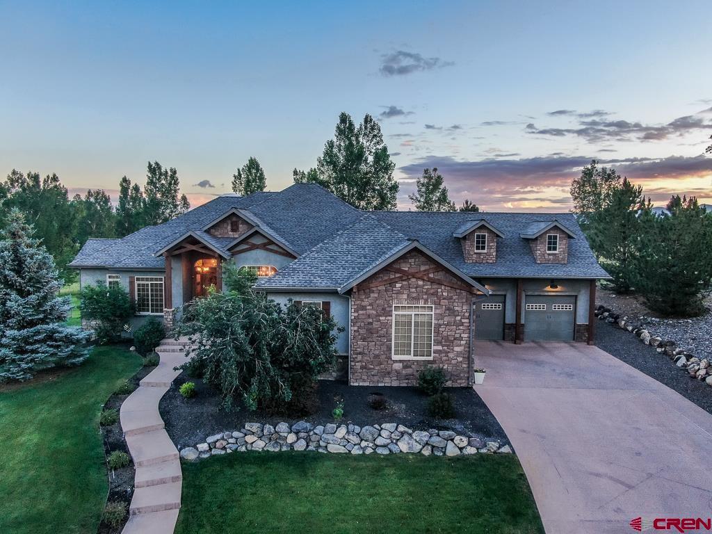 Brown Ranch offers the benefits of acreage without any of the maintenance. This 4,700+ sf luxury home (not including unfinished loft space) features a backyard that opens to huge private green space that is fully maintained by the HOA - all the privacy and beauty and none of the work! Homes rarely come available in this mountain view community. This home offers a large chef's kitchen with stunning granite stonework and custom cabinetry, hardwood flooring and luxury carpets, theater room, two gas fireplaces, family room with walkout to backyard open to a huge HOA maintained greenbelt. Master suite features vaulted/backlit ceiling, giant walk-in closet and spacious master bath with oversized soaking tub. The 4-car oversized garage provides room for all the cars, toys and adventure gear, workshop and/or home gym. The beautiful, low-maintenance landscaping looks great year-round.