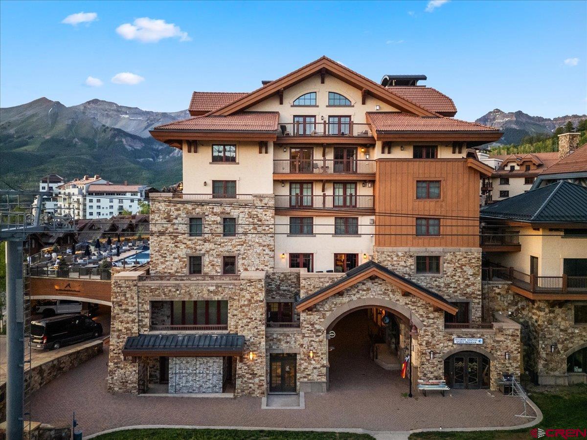 This exceptional Madeline 3-bedroom, 3.5-bath single-level condominium offers luxury living with room to elevate its value even further. Featuring three expansive deck spaces, air conditioning, and a lock-off suite, the residence is part of the prestigious Auberge-managed Forbes 5-star resort, providing ski-in/ski-out convenience on the Meadows ski run and access to premier amenities like valet parking, ski valet, room service, and owner services. The Sky Terrace pool and hot tubs offer relaxation, while the interior boasts a gas fireplace, hardwood floors, in-floor radiant heat in the primary bathroom, a steam shower, and a spacious private owner closet. With breathtaking views of Mt. Wilson, Palmyra Peaks, and vivid sunsets, this home is not only move-in ready but also priced with equity potential, making it the perfect opportunity to customize and create your dream Telluride retreat.