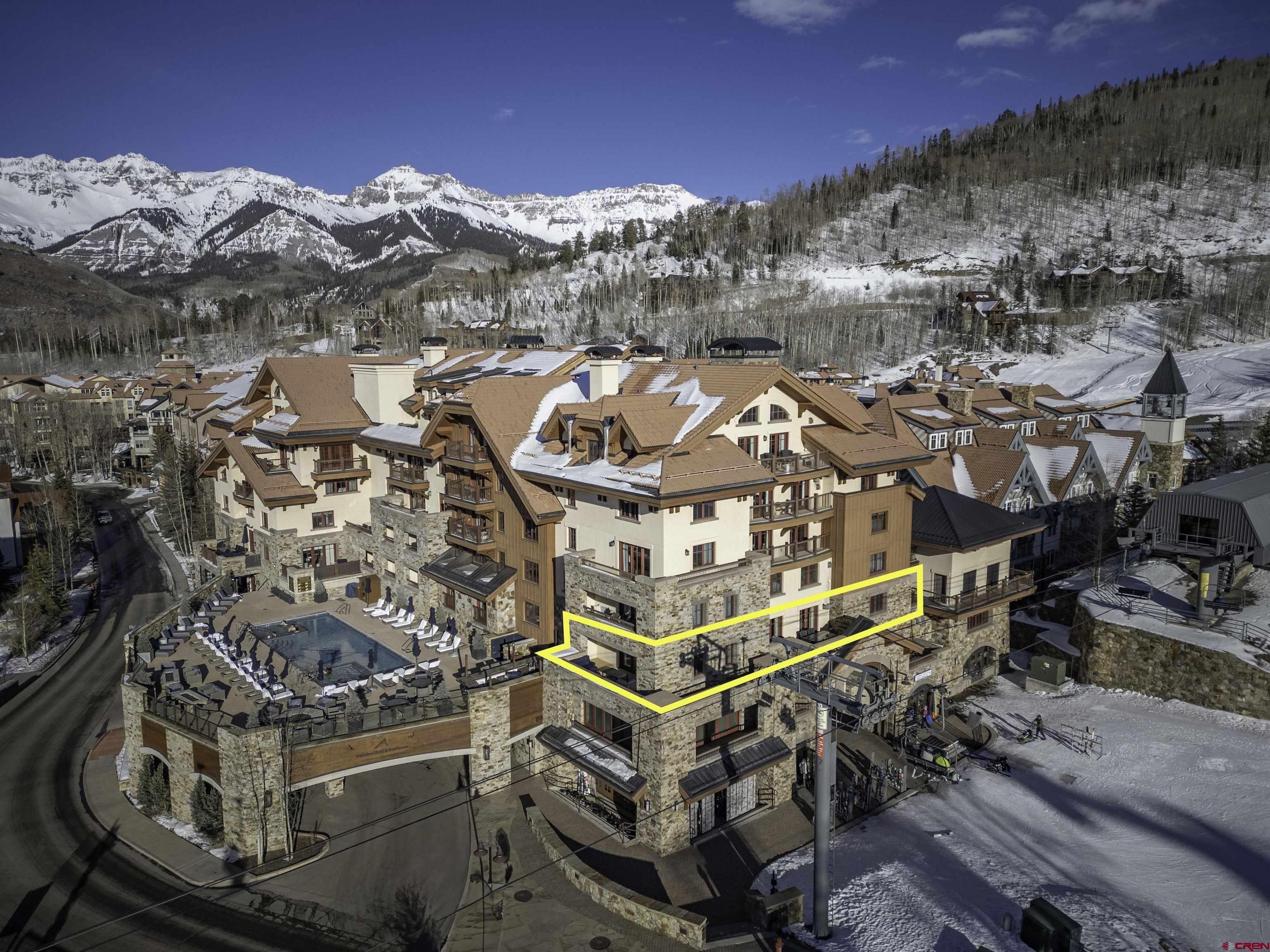 This exceptional Madeline 3-bedroom, 3.5-bath single-level condominium offers luxury living with room to elevate its value even further. Featuring three expansive deck spaces, air conditioning, and a lock-off suite, the residence is part of the prestigious Auberge-managed Forbes 5-star resort, providing ski-in/ski-out convenience on the Meadows ski run and access to premier amenities like valet parking, ski valet, room service, and owner services. The Sky Terrace pool and hot tubs offer relaxation, while the interior boasts a gas fireplace, hardwood floors, in-floor radiant heat in the primary bathroom, a steam shower, and a spacious private owner closet. With breathtaking views of Mt. Wilson, Palmyra Peaks, and vivid sunsets, this home is not only move-in ready but also priced with equity potential, making it the perfect opportunity to customize and create your dream Telluride retreat.