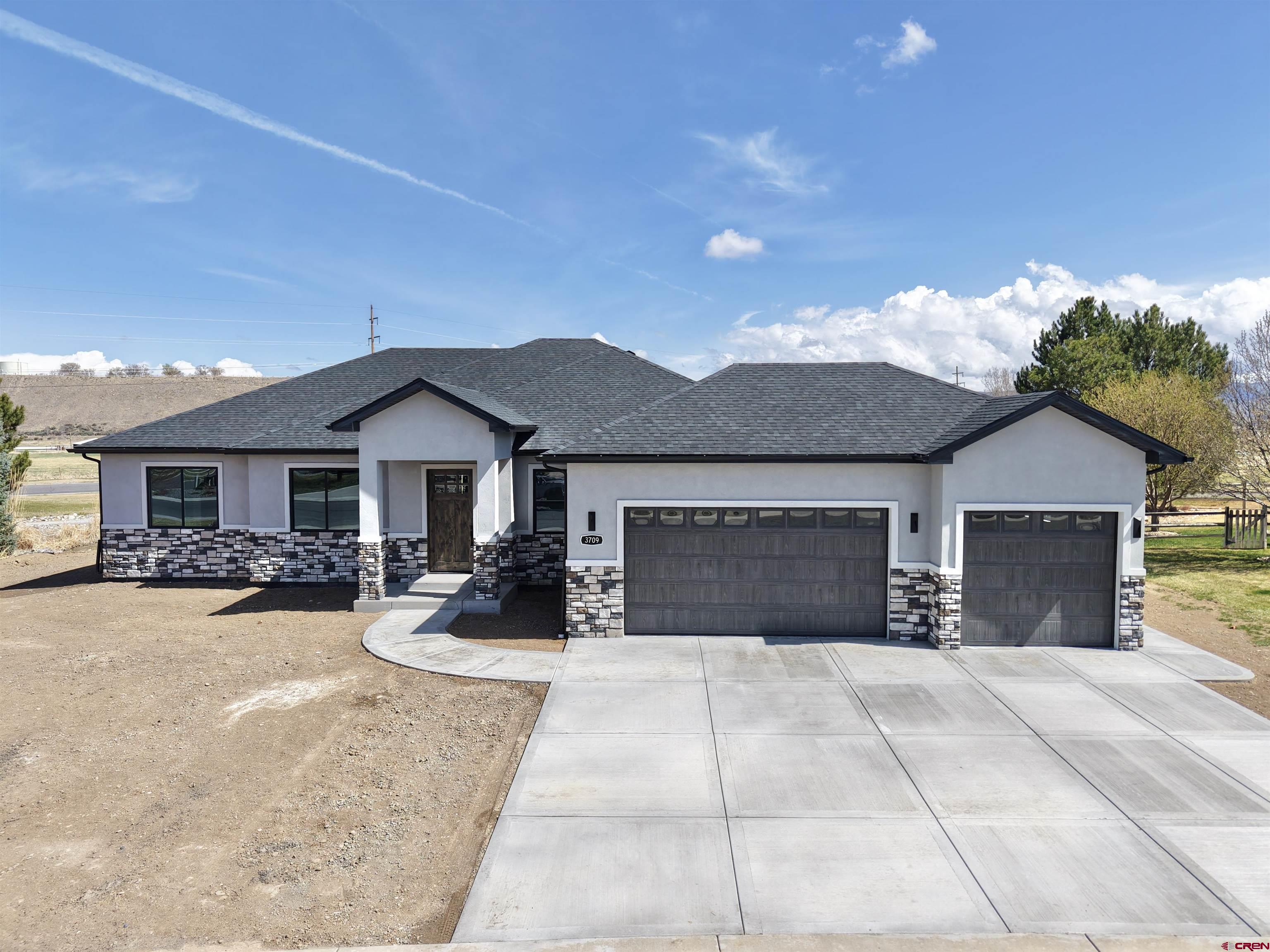 New construction. This beautifully designed home is overlooking the 9th green in Cobble Creek. So many features in this home to love including, Knotty Alder cabinets with a "smoke" finish, quartz countertops, large pantry, farm style kitchen sink, Knotty Alder interior doors and trim, GE stainless kitchen appliances which includes a double electric wall oven with microwave, black fixtures and hardware, gas fireplace, tray ceiling in living room, Luxury Vinyl Tile (LVT) flooring throughout, laundry room sink with additional cabinetry, beautifully tiled showers and stand-alone tub. Exterior features include a beautiful Knotty Alder entry door, stucco and stone exterior, black vinyl windows, 3 car garage, large covered back patio with T & G ceiling and fan and a stubbed out natural gas line. Garage is wired for an Electric Vehicle charger. This home is built according to the new building codes, is energy efficient and comes with a conditioned crawl space. There is a seasonal creek that borders the back corner of the lot. This home does have a Club Membership attached which will be transferred at closing. Membership includes access to the spa and on-site fitness center, tennis and pickle ball courts, golf and Clubhouse bar discounts as well as invitations to all Cobble Creek events.