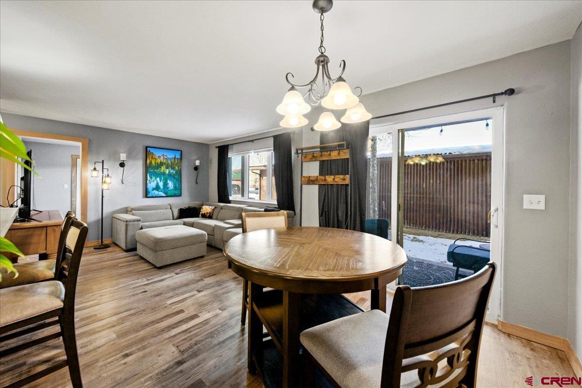 This amazing 2-bedroom, 2-bath condo is located in a small community in Ridgway, CO. The yard offers stunning views of the San Juan Mountains.  This property is an excellent investment opportunity, as workforce housing is in high demand. It could also serve as a second home or a wonderful forever home.  Ridgway is just an hour from world-renowned skiing in Telluride and two hours from Purgatory. Outdoor enthusiasts will love the many activities available within miles of the condo, including ice climbing, hunting, four-wheeling, and hiking.  This well-maintained unit features brand-new flooring and carpet, along with plenty of windows for abundant natural light. Additional highlights include natural gas forced-air heating, all appliances, and a stackable washer and dryer in a dedicated laundry room.  Outside, you'll find a spacious covered patio, a dedicated detached carport space, and a storage locker.