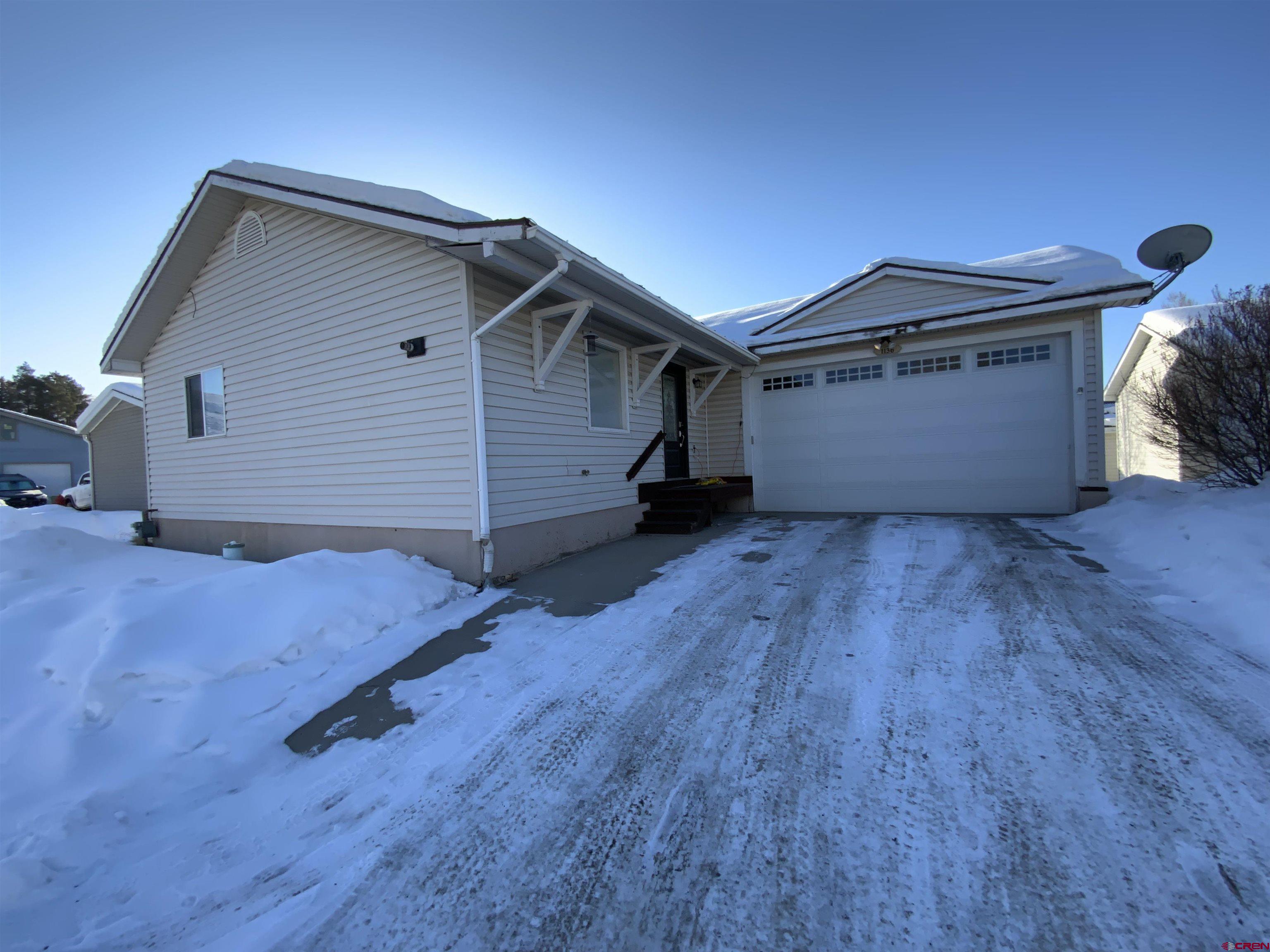 Welcome to 1136 North Colorado Circle, a charming 5-bedroom, 3-bathroom stick built single-family home located in the heart of Gunnison, Colorado. Built in 2003, this 2,402 square-foot residence offers a blend of modern updates and comfortable living spaces. The living and dining area as you enter, you’re greeted by engineered hardwood floors that flow seamlessly through the spacious living and dining areas, creating a warm and inviting atmosphere.  The kitchen has been thoughtfully designed, featuring granite countertops and modern appliances, making it a chef’s delight.  The main level includes the master bedroom and an additional smaller bedroom, providing convenience and flexibility. The main floor has radiant heat with the downstairs having hot water baseboard heat.  The finished basement boasts a large living space that could be a media room or second living room that would be perfect for entertaining and relaxation.  The three additional bedrooms and a full bathroom are located on this level, offering ample space for family. The attached two-car garage provides secure parking and additional storage space.  Situated across from the Rec Center and Meadow Park, this home offers easy access to recreational facilities and green spaces. It’s thoughtful design and prime location, 1136 North Colorado Circle is ready to welcome you home.