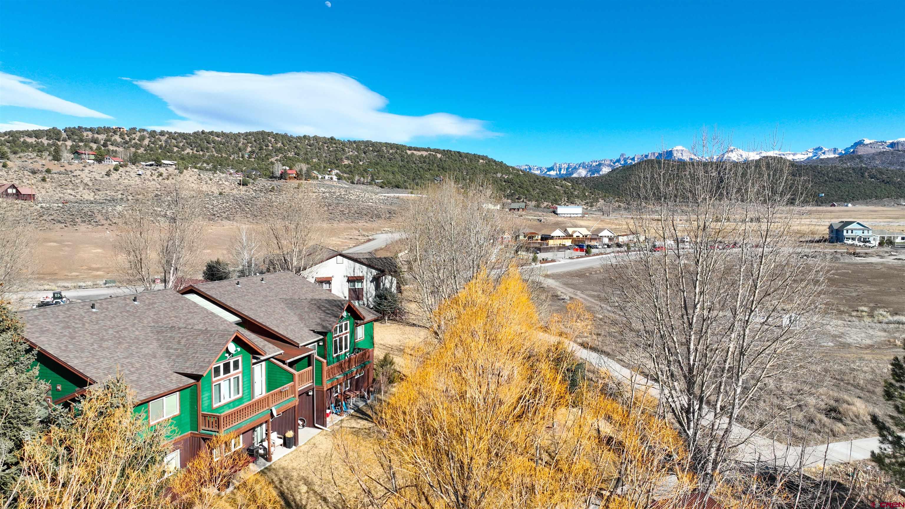 Charming 1-Bedroom Condo in Ridgway, CO – Stunning Views & Prime Location!  This exceptional 1-bedroom, 1-bath condo is nestled in a small, well-maintained community in Ridgway, Colorado, offering breathtaking views of the San Juan Mountains. Whether you're looking for a smart investment, a second home, or a retreat, this property is a rare find.  Ridgway is a gateway to adventure, located just an hour from world-renowned skiing in Telluride and two hours from Purgatory. Outdoor enthusiasts will love the proximity to ice climbing, hunting, 4-wheeling, and hiking—just miles from your doorstep.  Inside, inviting unit features updates, an open-concept living area with abundant natural light, and granite countertops. The kitchen boasts stainless appliances. A laundry room with a stackable washer and dryer adds convenience, while natural gas forced air heating ensures comfort year-round.  Outside, enjoy a spacious covered patio, a dedicated detached carport space, and a storage locker—perfect for keeping your vehicle snow-free and storing outdoor gear.