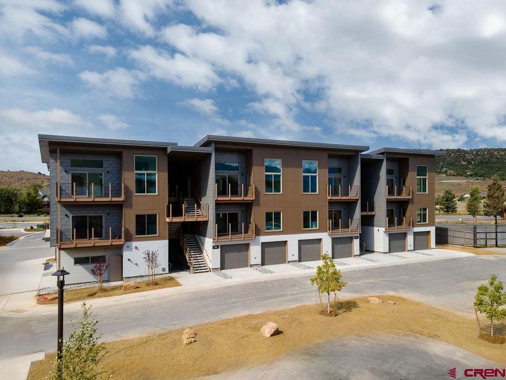 Perfectly situated as the only Ridgway residential project on the Uncompahgre River, Riverfront Village offers quick highway access to Telluride, Ouray, Silverton, and Montrose while a stroll down the river trail leads to downtown shops and restaurants. A certificate of occupancy for the 38-unit project is expected in July 2025. Take advantage of early pricing in this opening release! This unit has huge direct Box Canyon views into Ouray, a two-plus car garage, Air Conditioning, south south-facing deck, only one shared wall, and is located on the second floor. The property is a construction site and all tours must be with a RRV Team member.