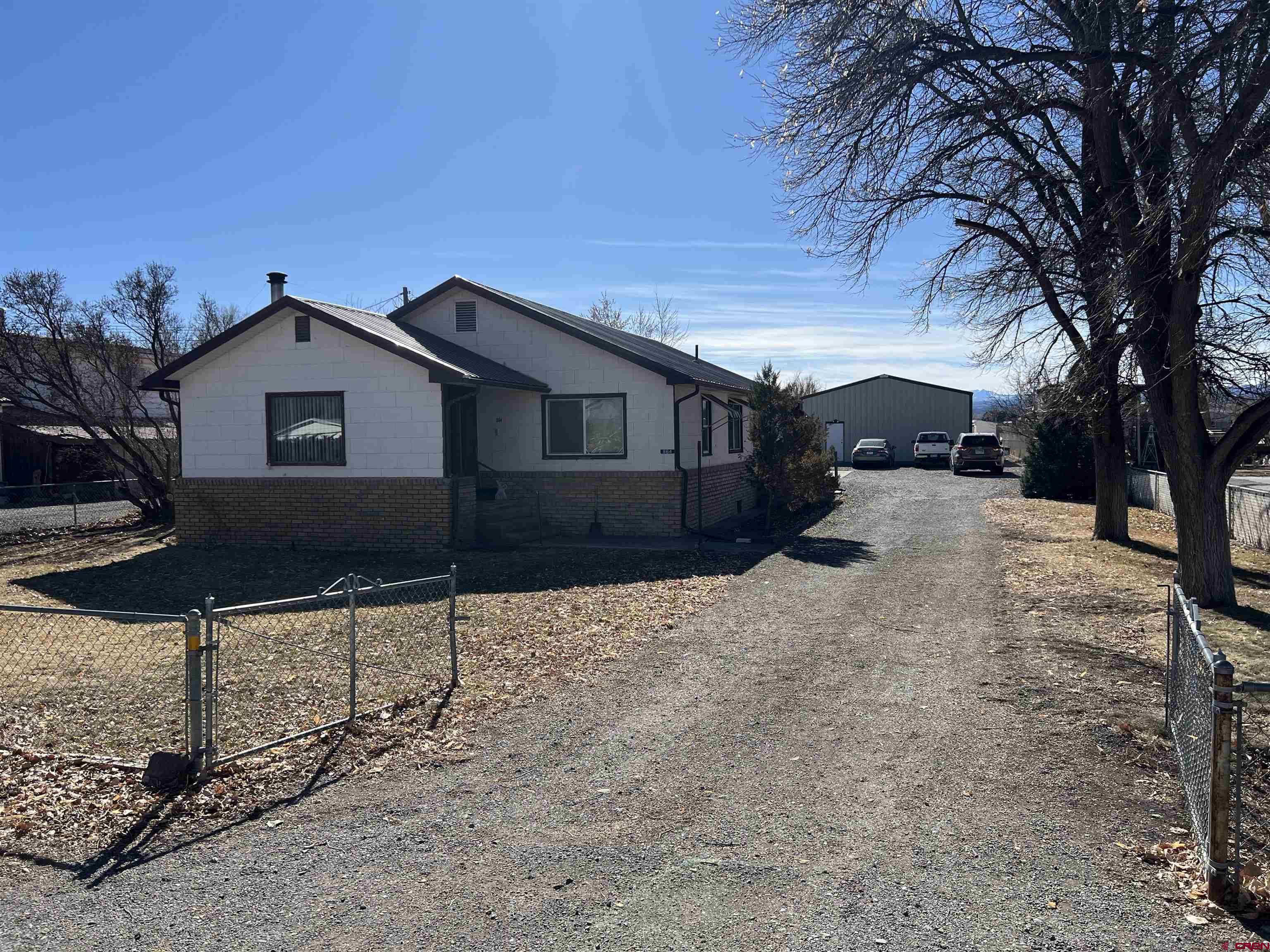 Charming farm house on over 4 acres just beyond the edge of the City limits. Current owners have enjoyed living in the home for over 30 years but they are ready to let someone else love it.  This one of a kind property is set up for horses or 4-H animals of your choice.  Nearly 3 1/2 acres of irrigated pasture, small horse barn with separate stalls and tach sheds. Gated pipe ready for next years irrigation.  30X40 insulated shop, concrete floors with an office and bathroom in the shop.  The shop has a separate sewer tap.  Permitted water well on the property.  The home is a typical farm home built in 1955 with a country kitchen, big windows and wood flooring. The living room has ample space and a wood burning stove.   Unfinished basement where the furnace and hot water heater are stored but could be remodeled to allow for more living space. Bring your animals, RV's and toys you will have plenty of space to store them with no HOA.   Don't miss this great opportunity.  This home has been well maintained but needs some updating and someone with a vision to make it an unbelievable investment.