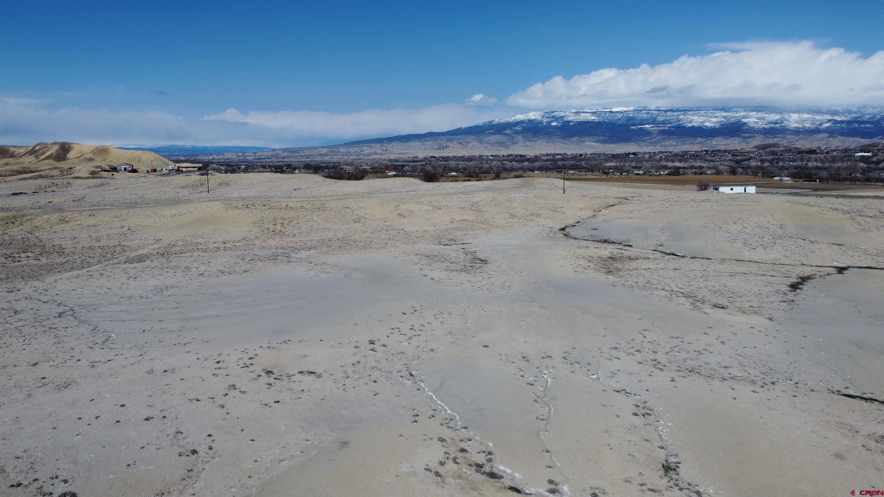 360 degree views!!  Place your home on one of many spots on this 13 acre parcel to enjoy the endless views.  You can see the Grand Mesa, the Uncompahgre, the San Juans, North Fork, and the rim of the Gunnison like they were in your back yard.  Centrally located for easy access throughout Delta County.  Comes with a paid and installed Tri-County Water Tap.  When looking at this property bring your hiking boots, you will want to explore.