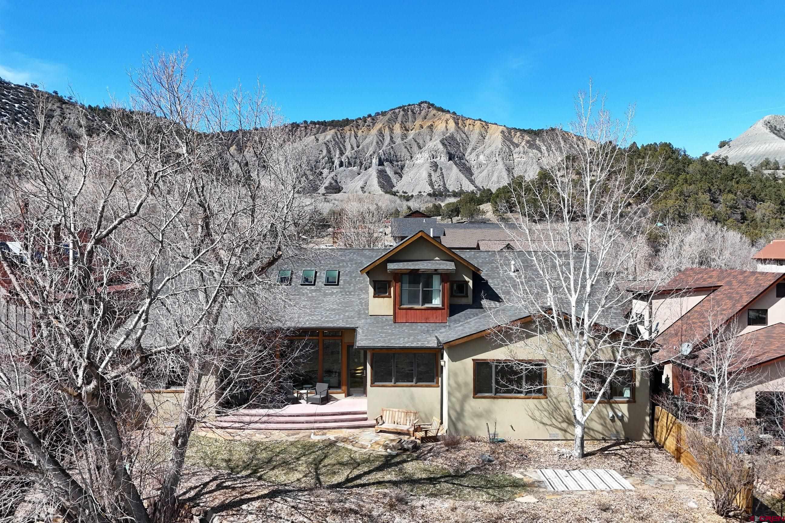 Located in one of Ridgway's most coveted neighborhoods, this custom 4-bedroom, 3-bath home sits on two oversized lots, offering unobstructed views of the Cimarron mountain range and stunning alpenglow sunsets. With direct access to a trail leading to downtown Ridgway and open space, this property seamlessly blends convenience with natural beauty. The chef’s kitchen is equipped with Wolf and Viking appliances, catering to culinary enthusiasts. Too many features to list—this is truly one of the finest homes in Ridgway. Furnishings are negotiable; art and personal items excluded. Schedule your private showing today!