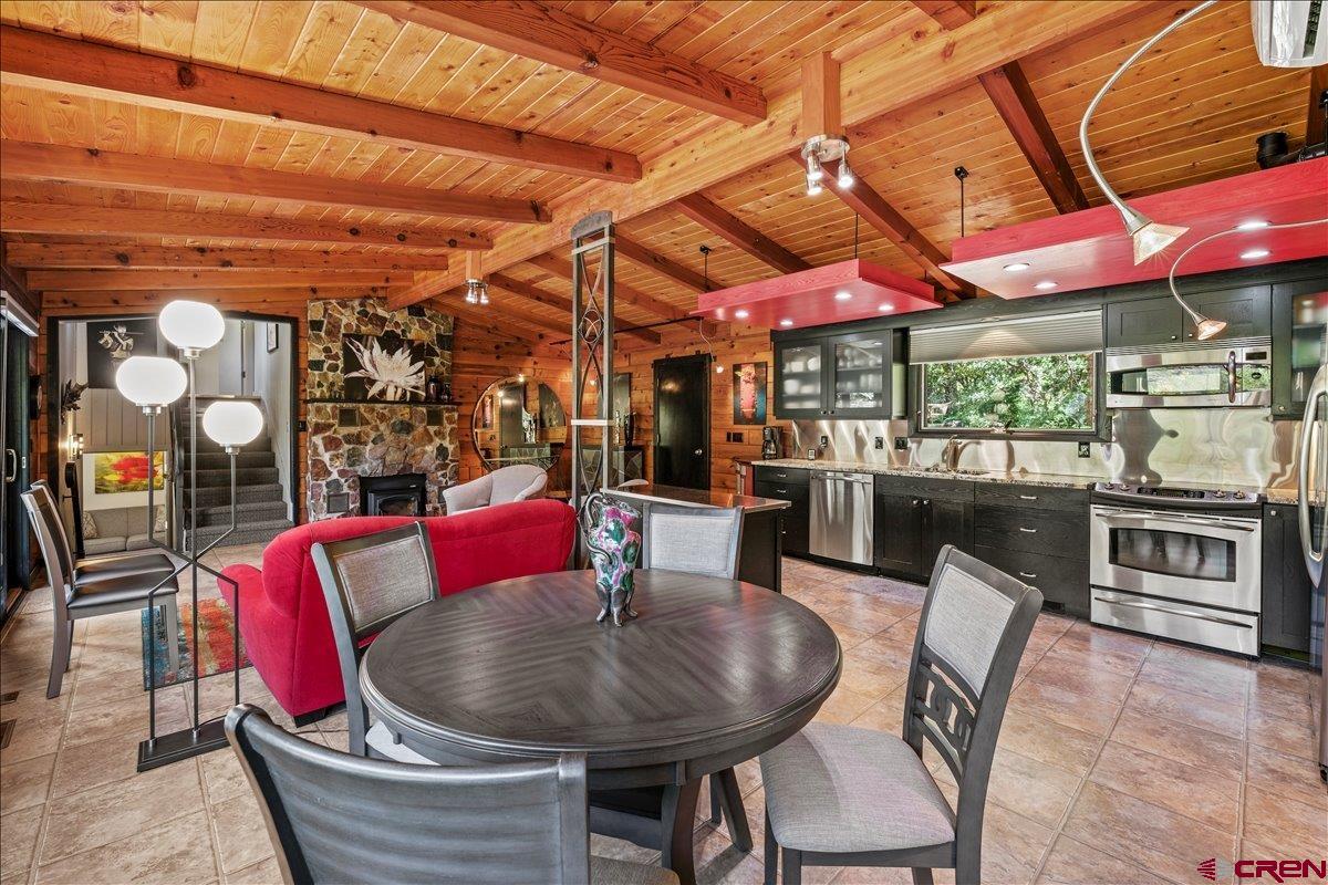 What is the definition of "Special"? The dictionary defines it as "Surpassing what is common or usual, exceptional or distinct among others of its kind". This home is the very definition of "Special". Located a few minutes from both Ridgway with its rich mining history and Ouray, a historic mining town, it affords you the opportunity to easily take advantage of everything the area has to offer not the least of which are hiking, biking, enjoying art galleries, live music and plays as well as fabulous restaurants. A quick hop onto Hwy. 550 takes you to Montrose for major shopping and Telluride with all its many activities and festivals in the summer and world class skiing in the winter. The terraced decks and patios allow for hours of enjoying the surrounding towering pines, magnificent red rock cliffs, spectacular mountain views and the changing seasonal colors: snow capped peaks in the winter, spring blooming forsythia and purple allium, the multicolored peonies in the summer, the red, yellow and oranges of the late summer daylillies in addition to the unequalled yellows and oranges of the aspens and oaks in the Fall. The home is a very open, spacious Mountain Modern masterpiece. The great room is unbelievably cozy surrounded in split cedar siding, wood beams and decking with the added charm from the wood burning stove nestled in the stone wall. The kitchen cabinets are set off by the stainless steel backsplash and appliances, granite counters and other remarkable accents. The kitchen sink overlooks the tranquil garden. The master suite is very large and features beautiful hardwood flooring, a walk thru dressing room with a double vanity, granite counter and plenty of closet space. The huge picture window affords a view of the garden and down the valley to Ridgway. An additional bedroom and bath set off by themselves provide lovely accommodations for family and friends who may just be more than comfortable and stay too long! Ditch water rights irrigate the lawns while beds are drip irrigated with Tri County water. The garage is listed as one car but is oversized. The home is being offered furnished including kitchenware but does not include the extensive art work. Unique lighting for art is in place, however. A turnkey situation that allows you to begin enjoying it immediately! This is an unequaled opportunity to retreat from the craziness of our world and spend quiet, restful time in a exquisitely beautiful setting. There are times when you simply have to experience first hand what such a special property has to offer. Come and take a look. You will not be disappointed.
