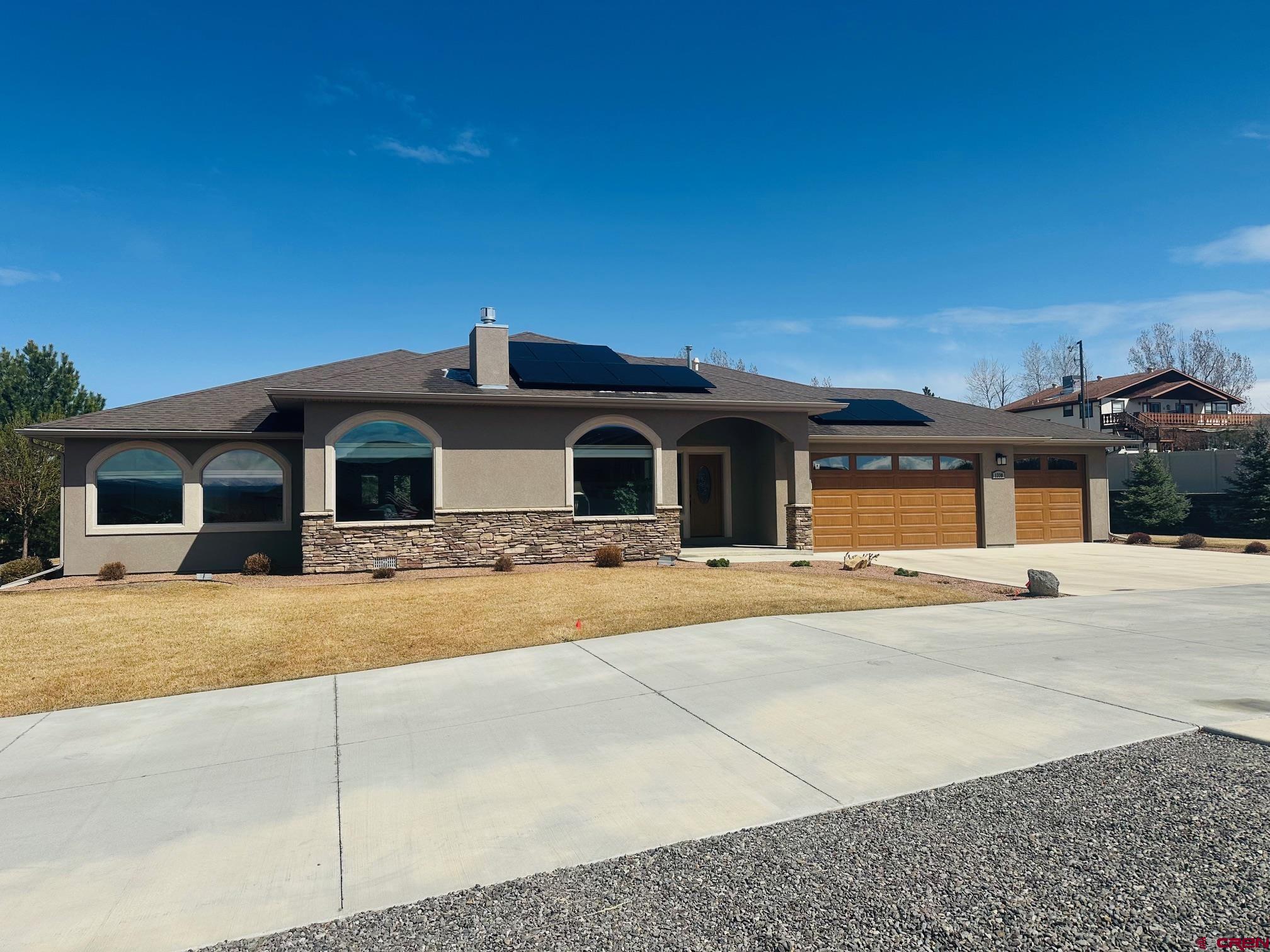 Check out this spacious 2,379 sq. ft. home with 3 bedrooms, office, 2 baths, an attached three-car garage and views of the San Juans. The open kitchen has a bar top—perfect for quick breakfasts or entertaining guests while you cook. The countertops in the home are granite and they are accompanied by hard wood or tile floors and oak cabinets. Off the kitchen you will find a large covered patio where you can enjoy your evenings with the view of the nicely landscaped property. The home also has a solar system in place to offset your power bill!  In the living room you will find vaulted ceilings a gas log fireplace and large windows that allow in natural light and show off the views of the San Juans. It’s the perfect spot to kick back and relax.  The primary suite with has plenty of closet space with two walk-in closets and a big walk-in tile shower.   You are conveniently located near shopping, walking trails, parks, golf and all the other amenities and activities Montrose offers! This home has been hardly lived in and is ready and waiting for you to come and enjoy!