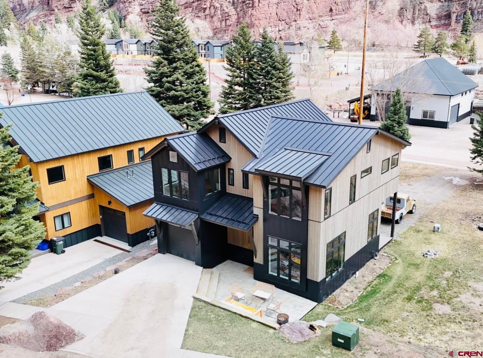 Discover the perfect blend of luxury and nature in this newly built mountain modern home, nestled in the heart of the San Juan Mountains. Located just minutes from downtown Ouray and across the street from the beautiful Uncompahgre river. This thoughtfully designed home offers breathtaking views, high-end finishes, and the serenity of mountain living.   Step inside to an open-concept living space with soaring ceilings, expansive windows and a contemporary kitchen design. The oversized island in the kitchen is ideal for entertaining after a day of adventure. Up the custom built staircase this home offers two primary suites with en-suite spa-like bathrooms and oversized windows to enjoy the beautiful mountain views from the comfort your bed. There are two additional bedrooms that provide space for family and guests, with thoughtfully designed layout that maximize views and natural light.      Don’t miss this rare opportunity to own a stunning newly built custom home in one of Colorados most picturesque mountain towns. Schedule your private tour today!