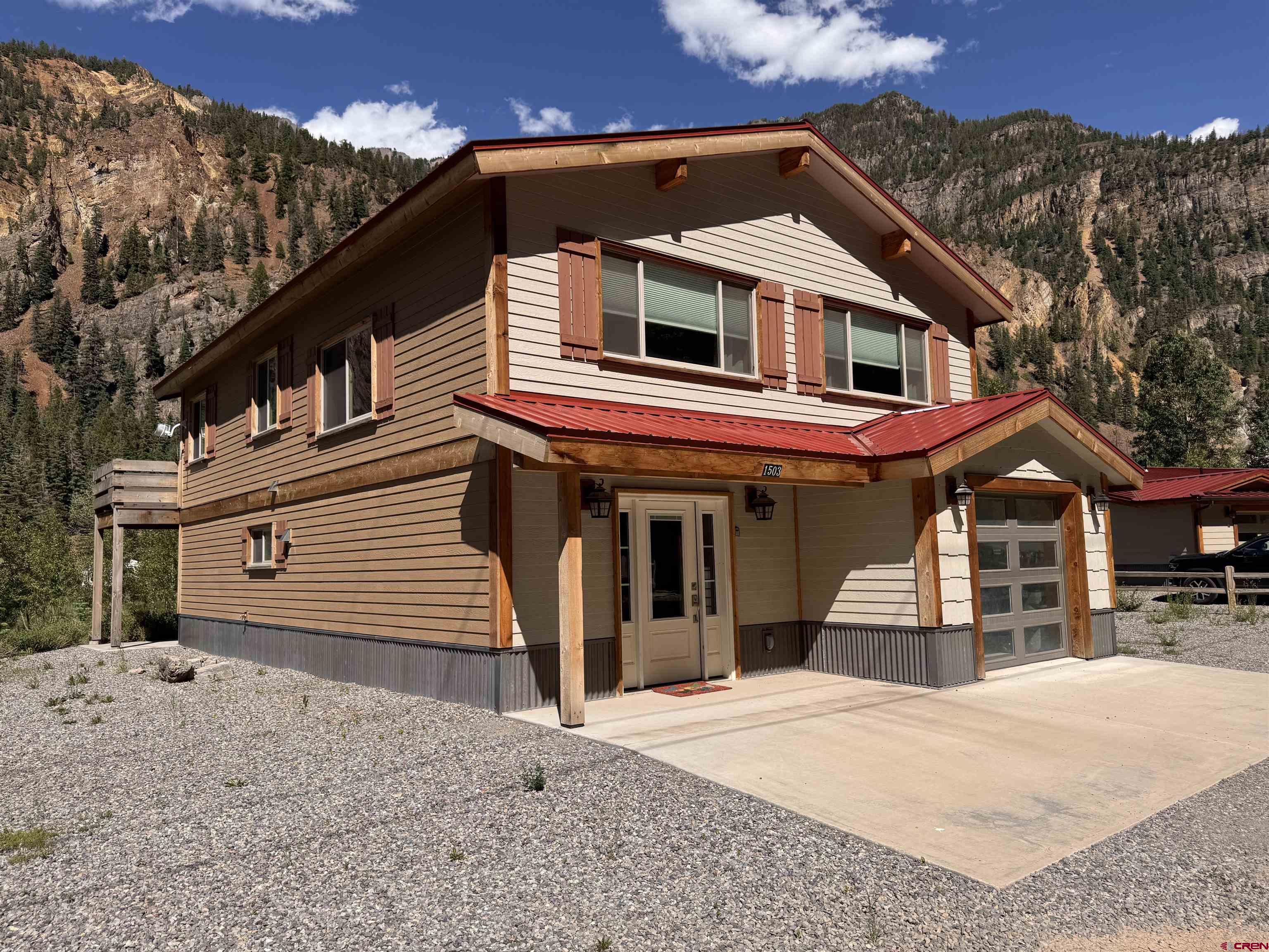 This wonderful property has 3 bedrooms and 3 3/4 bathrooms highlighted by a sunny deck overlooking the Uncompajgre river and trail. Views up and down the river and straight up the spectacular mountain sides. The home is appointed in a modern style. Two bedrooms are downstairs, each with en suite baths and patios. Completing the large large entry you will find laundry and the garage downstairs as well. The primary is upstairs off the kitchen. Plenty of parking. This has been a successful vacation rental but would also make a comfortable private residence.  Come sit by the river and savory life in the mountains.