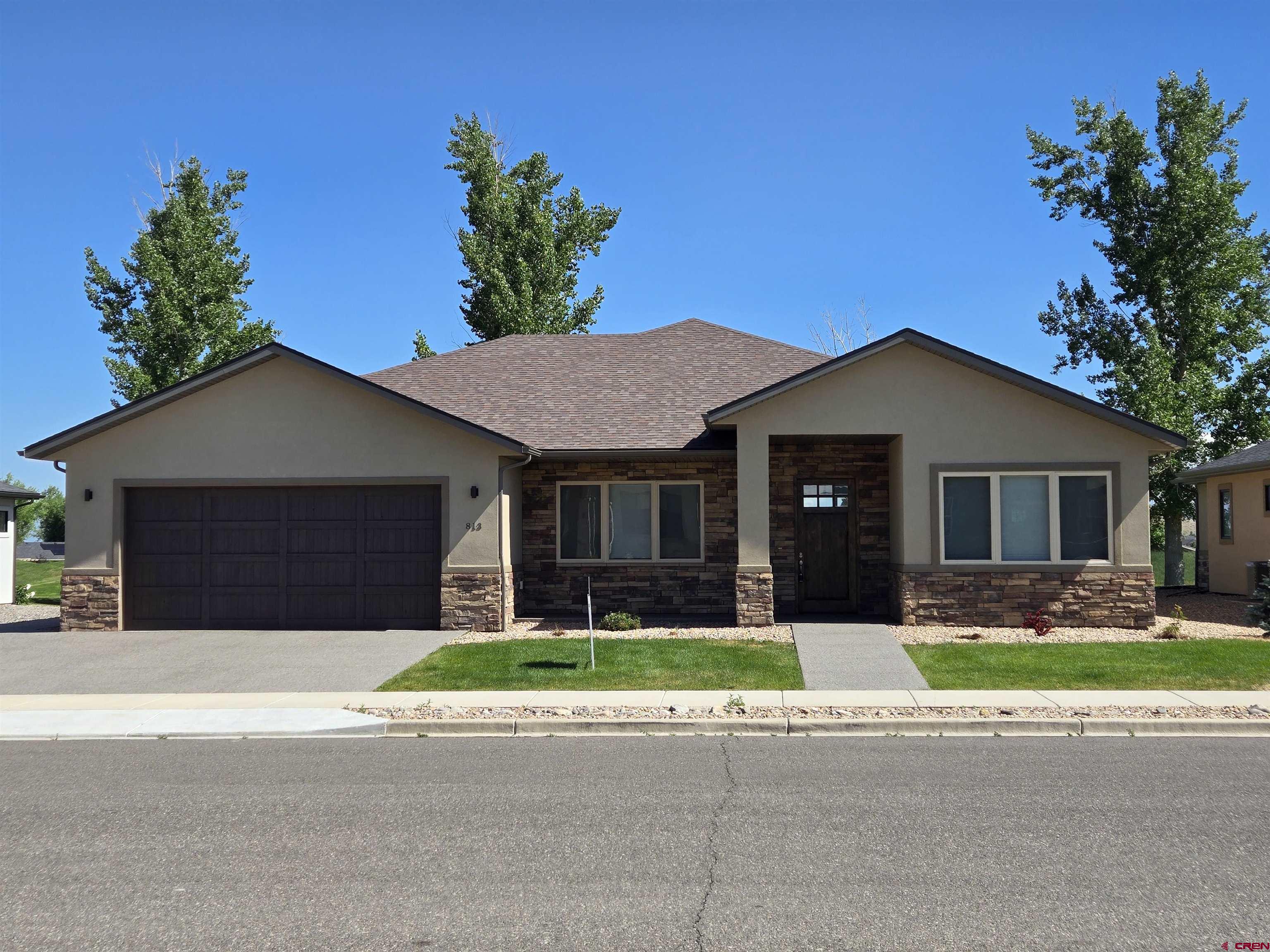 Make an appointment soon to explore this rare find in the Cobble Creek Golf Community: A recently built and immaculately kept Patio Home on the golf course within the San Sophia West Subdivision. Begin with an inviting, extra-wide entry that leads to a spacious Great Room with a view of the 6th tees below the cottonwoods. The living area, featuring a beautiful Stone Gas Fireplace, is open to the kitchen and spacious dining area. The kitchen is centered around a beautiful Granite topped Island with a Breakfast Bar, corner Pantry, and Frigidaire stainless appliances including a  5-burner gas Cook Top,  wall-mounted Microwave, and Electric Oven.  The split floor plan provides for a private Primary Bedroom with an en Suite Bath with granite countertops, large double sinks, a spacious shower, and a large walk-in closet. Guests are afforded their privacy as a pocket door creates a guest suite with private access to the bedroom and a full bath. The 3rd bedroom doubles as an Office with French doors. The laundry room includes a utility sink and plenty of storage compartments and counter space.  Custom top-down bottom-up shades have been installed on all large windows. The spacious, covered back patio is perfect to enjoy shady outside living plus there's a natural gas outlet for your grill. The oversized 2-car garage has a Golf Cart Bay in the rear plus a separate roll-up door for cart access.  Zero-grade (no steps) entry provides convenient and easy access from the garage. Landscaping is fully in place around the home and the neighborhood Sub-HOA provides the irrigation water, lawn maintenance, and snow removal.  (Yes, it’s truly Lock & Leave for those who love to travel).  When you're home, enjoy the golf community lifestyle with your included Cobble Creek Clubhouse membership providing you access to the private fitness gym, spa, pickleball courts, and clubhouse activities.