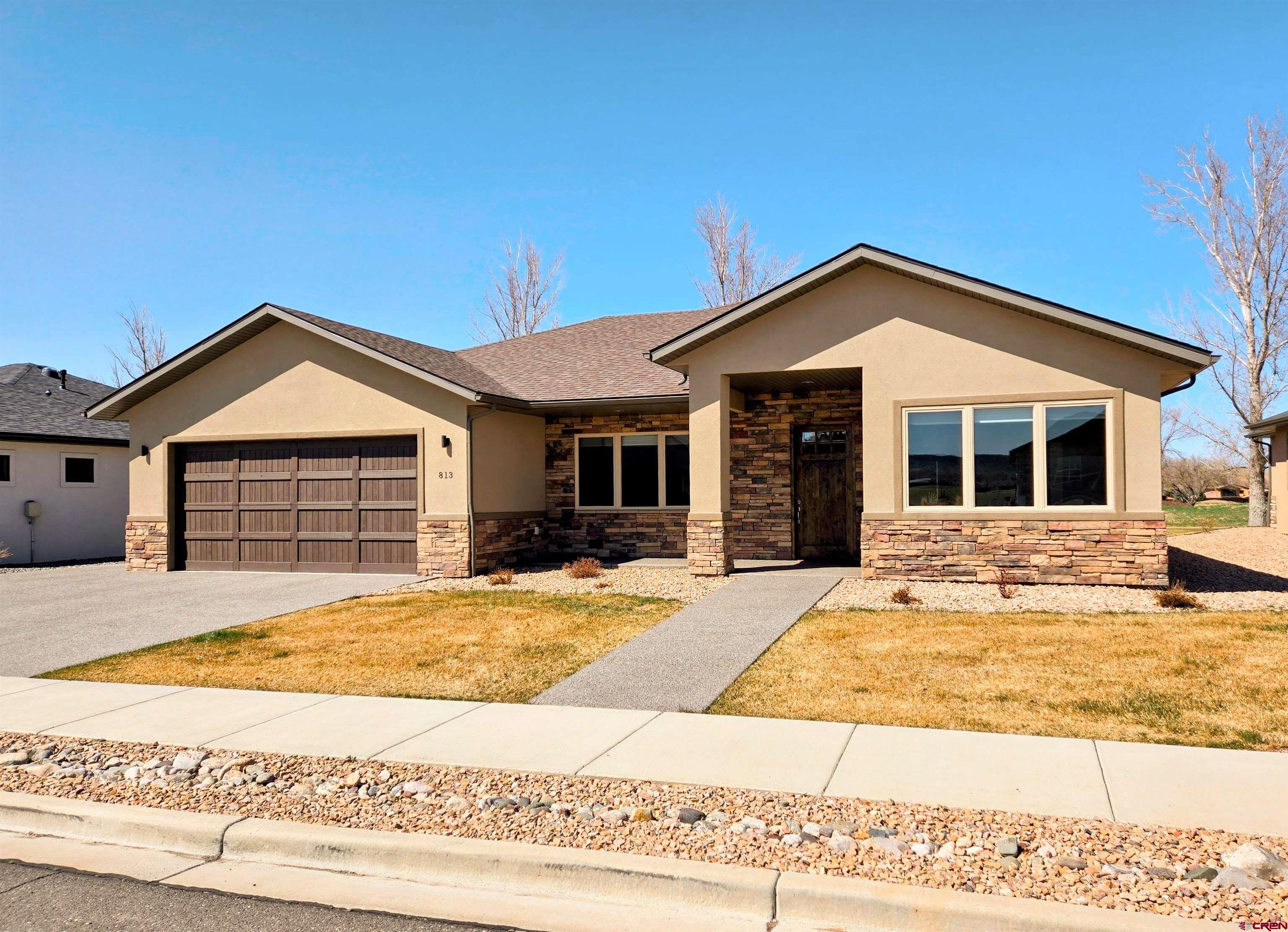 Make an appointment soon to explore this rare find in the Cobble Creek Golf Community: A recently built and immaculately kept Patio Home on the golf course within the San Sophia West Subdivision. Begin with an inviting, extra-wide entry that leads to a spacious Great Room with a view of the 6th tees below the cottonwoods. The living area, featuring a beautiful Stone Gas Fireplace, is open to the kitchen and spacious dining area. The kitchen is centered around a beautiful Granite topped Island with a Breakfast Bar, corner Pantry, and Frigidaire stainless appliances including a  5-burner gas Cook Top,  wall-mounted Microwave, and Electric Oven.  The split floor plan provides for a private Primary Bedroom with an en Suite Bath with granite countertops, large double sinks, a spacious shower, and a large walk-in closet. Guests are afforded their privacy as a pocket door creates a guest suite with private access to the bedroom and a full bath. The 3rd bedroom doubles as an Office with French doors. The laundry room includes a utility sink and plenty of storage compartments and counter space.  Custom top-down bottom-up shades have been installed on all large windows. The spacious, covered back patio is perfect to enjoy shady outside living plus there's a natural gas outlet for your grill. The oversized 2-car garage has a Golf Cart Bay in the rear plus a separate roll-up door for cart access.  Zero-grade (no steps) entry provides convenient and easy access from the garage. Landscaping is fully in place around the home and the neighborhood Sub-HOA provides the irrigation water, lawn maintenance, and snow removal.  (Yes, it’s truly Lock & Leave for those who love to travel).  When you're home, enjoy the golf community lifestyle with your included Cobble Creek Clubhouse membership providing you access to the private fitness gym, spa, pickleball courts, and clubhouse activities.