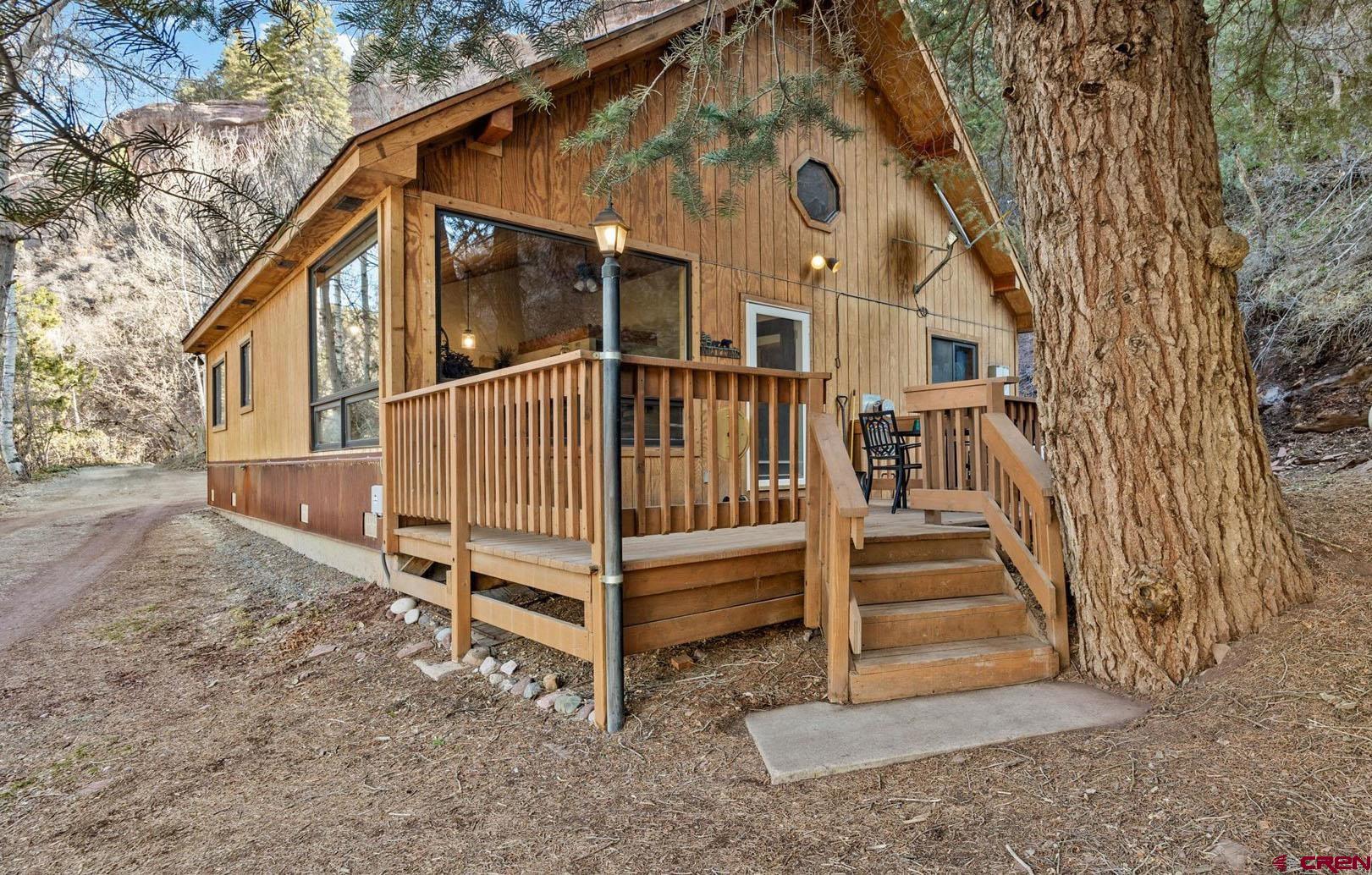 Unbelievable Opportunity and Potential in Ouray, Colorado, with Quintessential Mountain Home, Massive Shop, and Soaring Views! The perfect basecamp for everything that the best mountain range in the US has to offer, this exceptional property delivers unmatched versatility and functionality.  Let's flip the script and start with the nearly brand-new 60’ x 30’ shop of your dreams. Heated by natural gas, insulated, water tapped, equipped with endless storage, finding a property offering this amenity with easy access to Highway 550 is a needle in a haystack. Even better, no HOA or covenants allow you to let freedom reign in one of the most beautiful and special places in the world with endless recreational opportunities. Store your ATV’s and Side by Sides, your Class A RV, your project cars or whatever your hobbies are, this shop can accommodate everything you’re bringing and more. Wander up to your idyllic, alpine home in the mountains, surrounded by jaw-dropping views and majestic pine trees. Step inside to an intimate, warm environment featuring large gallery windows capturing the views and an abundance of natural light. The main kitchen/living/dining area is an open layout, with a fireplace, vaulted ceilings, and provides a wonderful haven for rest and relaxation after unforgettable adventures in the San Juans. The home has 3 bedrooms to accommodate everyone, and even has a mutli-use laundry/utility room to keep the mess out of sight. Sip your favorite beverage and soak in spectacular scenery on your front porch, or wander over to your own private firepit with Whitehouse Mountain towering above you. Restorative and just plain fun hot springs, more jeep trails and passes than you can imagine, world class skiing in Telluride, hiking, mountain biking and trail running singletrack in every direction, everything from elevated cuisine to greasy bacon cheeseburgers to handcrafted, local breweries, curated and creative shopping on every corner with unique, alpine experiences everywhere you look. Capitalize on the versatile valley zoning in this unmatched location, allowing you to solidify your assets in what would be an excellent, cash-cow investment property. You’ll have to pinch yourself walking down main street. You’re not dreaming. This is the magic of Ouray, Colorado. Come Discover It and Make this Incredible Property Your Mountain Basecamp Today!