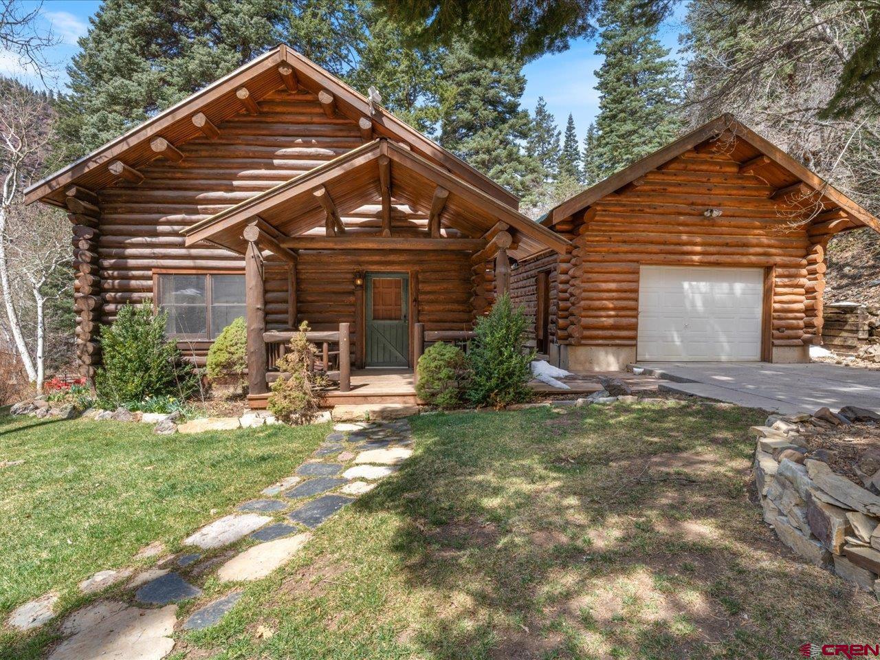 A don’t miss opportunity! Imagine yourself in this picturesque 1,677 square feet log cabin with three bedrooms and two baths, a 540 square feet two car detached garage. There is an additional stick built, four car garage with 960 square feet of garage space also including a second floor one bed, one bath apartment with a large great room and office above.  The log home has beautiful hardwood floors, a claw foot tub, a nice loft that can be used for an office or reading nook, and an en-suite upstairs bedroom with walk-in closet. Circle your friends around the living room gas-fired stove with hot-toddies or cocoa with marshmallows as the snow pillows on the evergreens outside.  There are two additional detached storage sheds for all your backcountry toys or create a dog run for Rover. Situated on almost an acre, the yard is landscaped with beautiful seasonal flowers and lush green grass, all watered with an automatic watering system. Follow the backyard to an elevated pathway up to your own secluded patio for a joyous summer BBQ. Kick your feet up around the stone fire pit and enjoy the autumnal aspens framing the quintessential mountain views, all of which backs to National Forest. It’s as if the property just keeps on going. This property is currently an income producer and the main house is fully furnished with updated fixtures and in-room efficiency heaters. Showings subject to rental calendar.