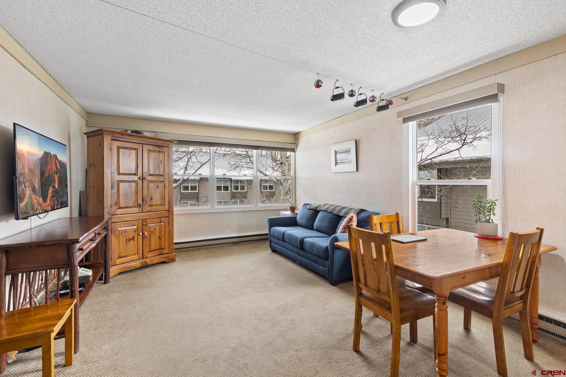 Secure this top-floor corner ski-in/out residence at Mountainside Inn, a true 1-bedroom, 1-bath offering both personal enjoyment and lucrative investment potential. Boasting a prime west and northern orientation, this bright and sunny apartment features a full-sized kitchen and living room along with upcoming LVP flooring installation adding even more value. Steps from Lift 7, the River Trail, and the West End's dining and shops, this pied-a-terre is ideal for full-time living or long-term rental, while proven short-term rental history at the Inn also promises solid income. Enjoy hassle-free ownership with on-site management handling everything from housekeeping to maintenance, making this a turn-key opportunity in a sought-after location.