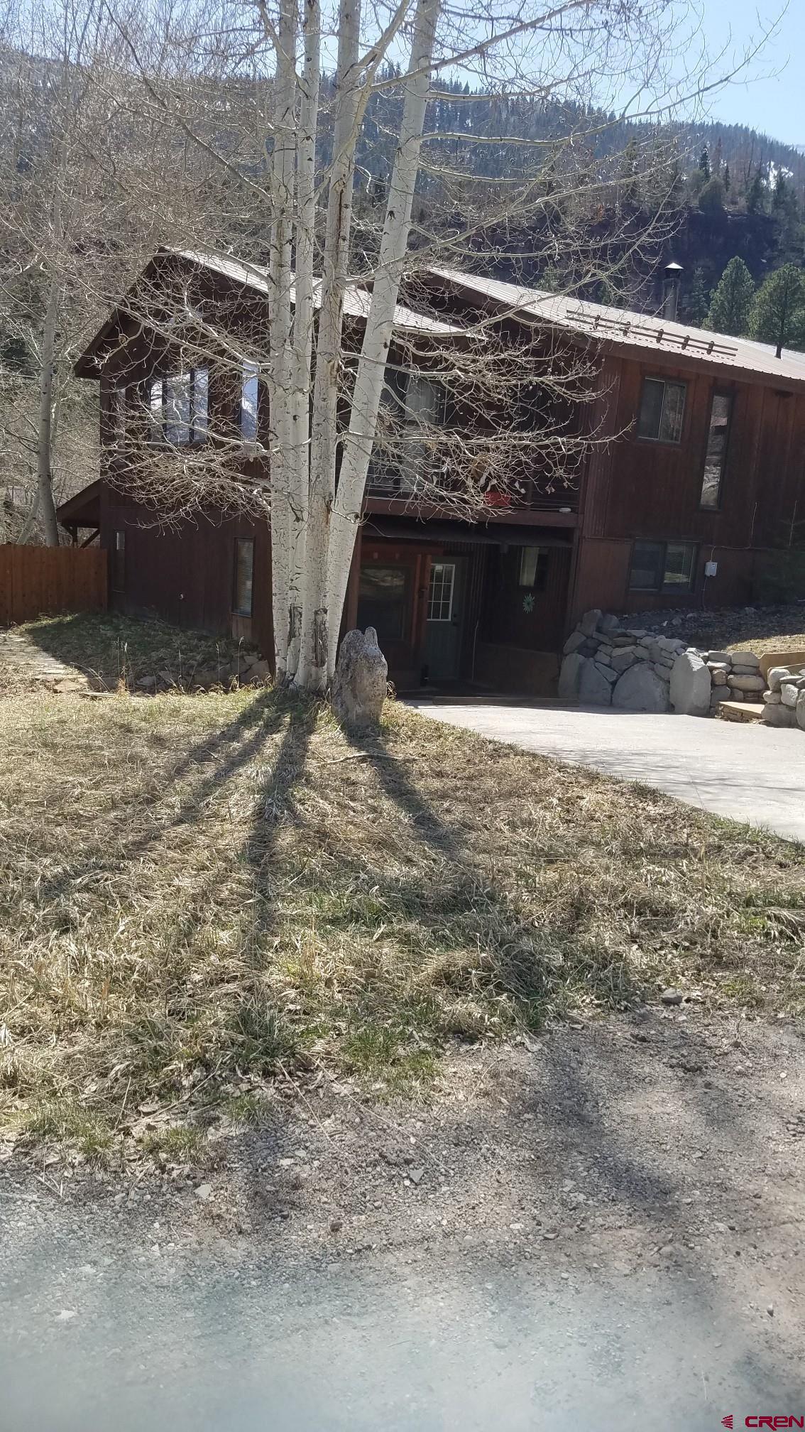 Large well maintained family home with small separate 1 bedroom 1 bath apartment with small patio. Ideal family home has 3 bedrooms with 2 full bath open living area, office, dining area and flex room. Attached 2 car garage, a large well manicured lawn complete with aspen/cottonwood trees yard is fully fenced. Bedrooms each have access out onto the south facing open deck area as well. Views of Mt. Abrams and Corbett Peak. Minutes to hot springs, river walk and town.