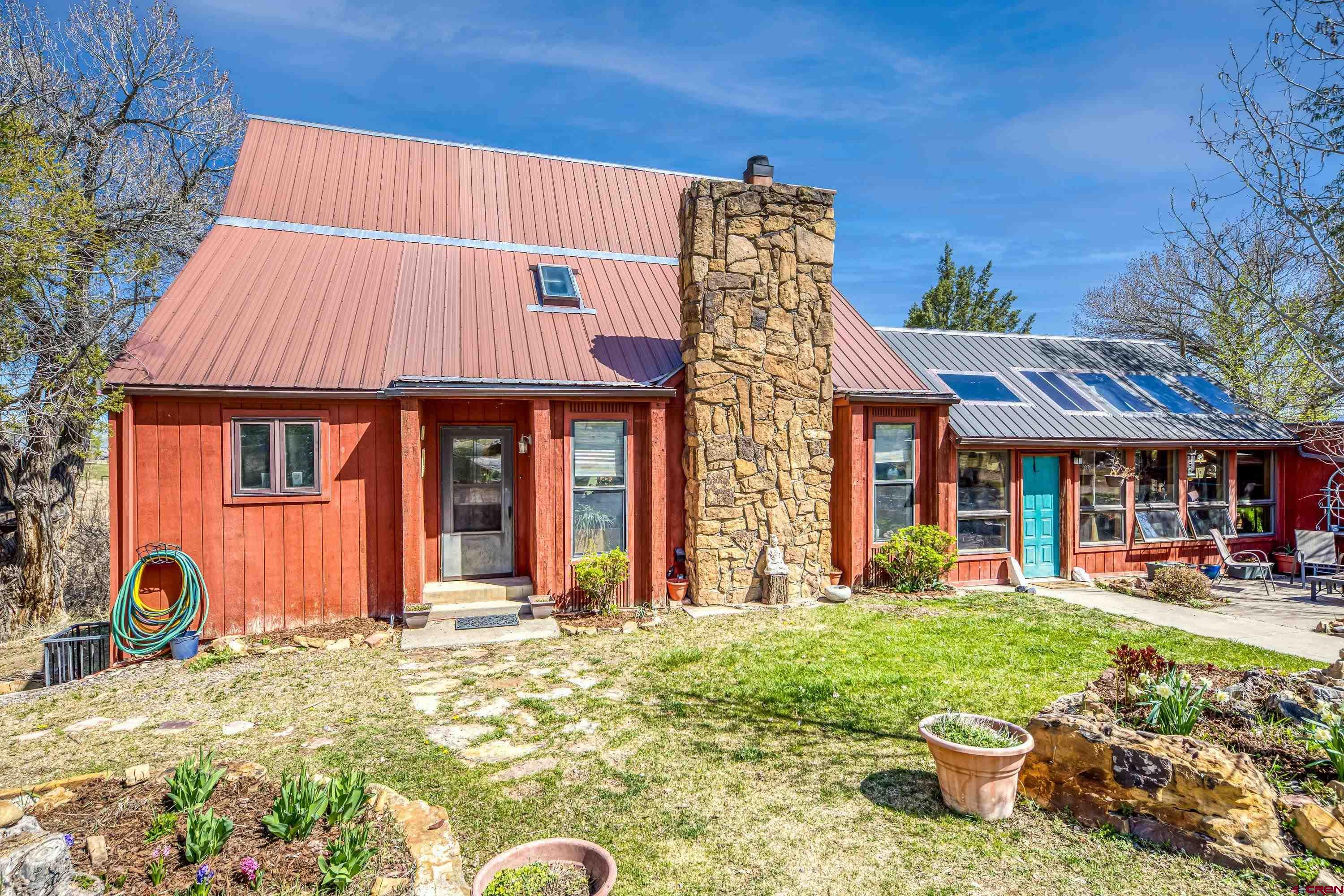 Imagine a horse property nestled on 5 irrigated acres of land, surrounded by lush greenery, garden spaces, scenic landscapes and even distant mountains on the horizon. Privacy here reigns supreme, with natural barriers like tall trees forming a cocoon of serenity around the estate.  The location is prime—accessible yet tucked away. It’s close enough to conveniences like local shops, schools, and equestrian trails, but far enough to feel secluded. The property features pastures for grazing, sturdy fences, and even a charming 48x36 barn with spacious stalls, a tack room, wash bay, hay storage and kitchen/break room. There is a finished bonus room above the barn for overnight quests or a helper's bunk. There is a regulation sized riding arena for training and practicing.  At the heart of the property, there’s a charming 2 story home with 2 car attached garage classic architectural details, open concept, vaulted ceiling and a loft overlooking the family room with a lovely fireplace. Large mudroom to kick off your boots and a greenhouse/sunroom for all your herbs and flowers. A walkout 1 bedroom, 1 bathroom apartment below with a kitchen, dining area and living room. Adjacent to the main home is a tiny house with a modern twist, perfect for guests, a private retreat, or a creative workspace.  This haven is designed to offer peace for both horse and human, where every sunrise over the fields feels like a gift. Does this vision match what you had in mind?