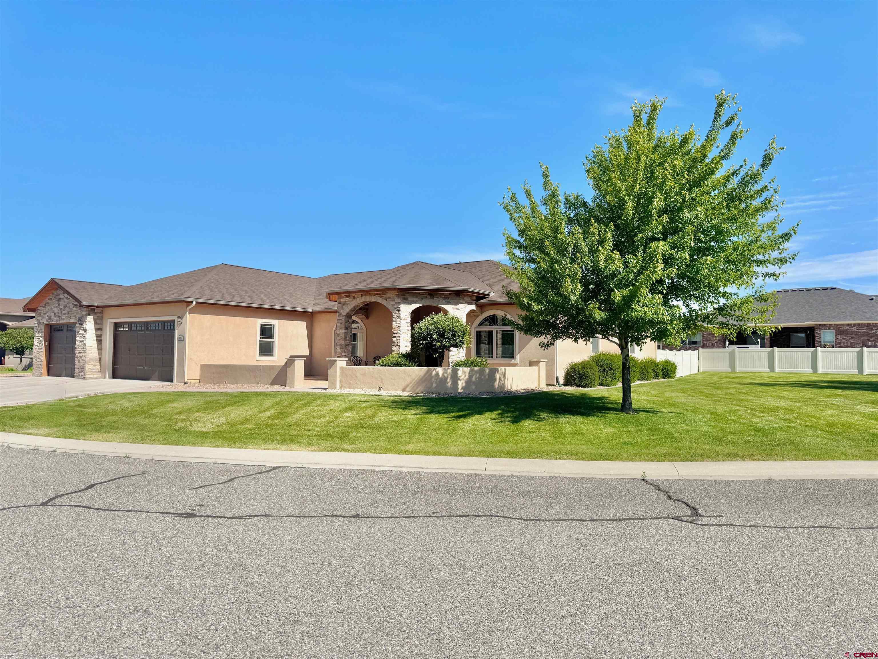 Experience luxurious single-level living in this beautifully appointed 3-bedroom, 3-bath residence, complete with a spacious office, nestled on a desirable corner lot in the tranquil Belle Haven Estates. Enjoy stunning mountain views and the peaceful ambiance of a quiet, established neighborhood.  From the moment you arrive, custom wrought iron front doors and a stoned, covered entry patio create a grand first impression. Step inside to a generous open-concept living area featuring beautiful knotty alder wood trim and doors, soaring ceilings, a cozy gas fireplace, teak wood floors, and seamless flow into the gourmet kitchen. Designed for both function and style, the kitchen showcases rich knotty alder cabinetry, granite countertops, stainless steel appliances, abundant counter space, a large walk-in pantry, a large bright skylight, breakfast nook, and direct access to a covered back patio and a fully fenced, private backyard oasis.  The thoughtful split floor plan offers ultimate privacy. Two spacious guest bedrooms share a well-appointed bathroom with double vanities and a tiled shower. The expansive primary suite is tucked away on the west wing of the home, boasting a luxurious ensuite bath with a jetted soaking tub, a large walk-in tiled shower, dual vanities, a huge walk-in closet, and an additional storage closet. A private door leads from the suite to an enclosed hot tub area, perfect for quiet relaxation.  The oversized office/craft room or formal dining room features large south-facing windows that fill the space with natural light.  Situated across from an open area, the home enjoys an added sense of privacy and serenity.  Home currently has fast Elevate internet.  The HOA provides irrigation water, keeping lawn watering costs low in the summer.