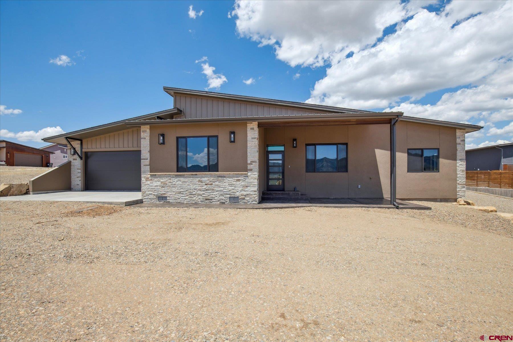 THIS BEAUTIFUL HOME IS READY TO MOVE IN.... Brand New Construction of Exquisite Contemporary Style and Design in a very desirable location just south of the Cortez city limits. This planned unit development is located in Montezuma County but less than a mile to great shopping, schools and restaurants with beautiful views of the mountains and vista's of the surrounding ranges. Blue Mesa Lot #6 is an 1,622 SF, 3 Bedroom 2 Bath Cruzan Creation of outstanding contemporary design and appeal with an artistic use of different textiles comprised of wood and stone accents, granite, ceramic tile, composite flooring and stucco exterior. Perfect maintenance free living for that family on the go or the couple that just wants to relax and enjoy the views while their at home. The Great Room effect has lots of natural light from the large windows that really shows off the exposed beams and beautiful cabinetry in the kitchen. The Master Suite has a beautifully tiled bathroom and a very spacious closet. This property is a fantastic opportunity own a very special home of Superior Appeal along with the ease and convenience of maintenance free living.